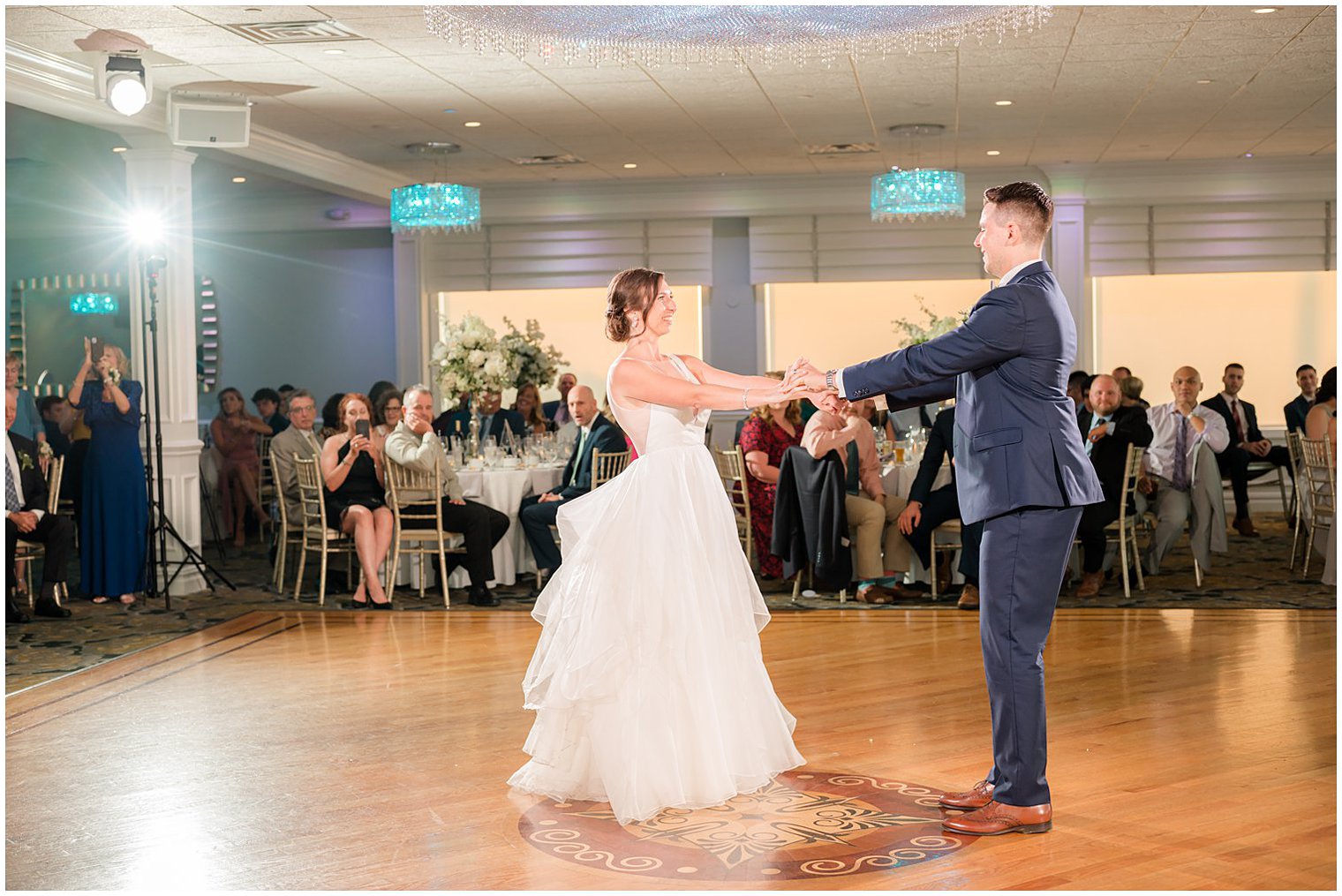 groom twirls bride during first dance at reception in Point Pleasant NJ