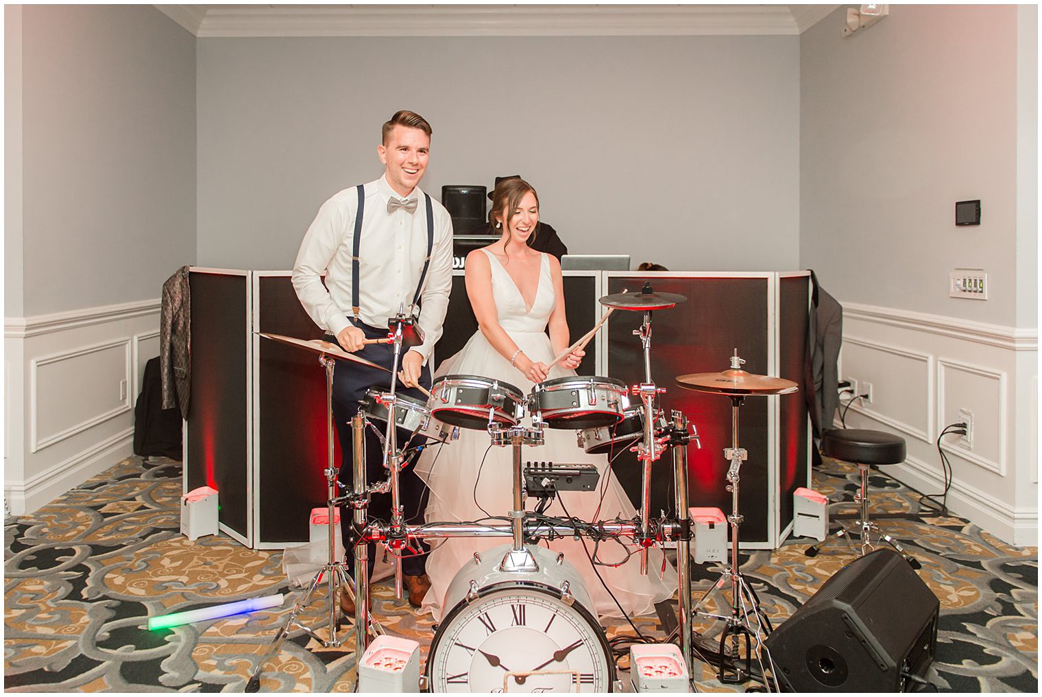 newlyweds play drums during NJ wedding reception