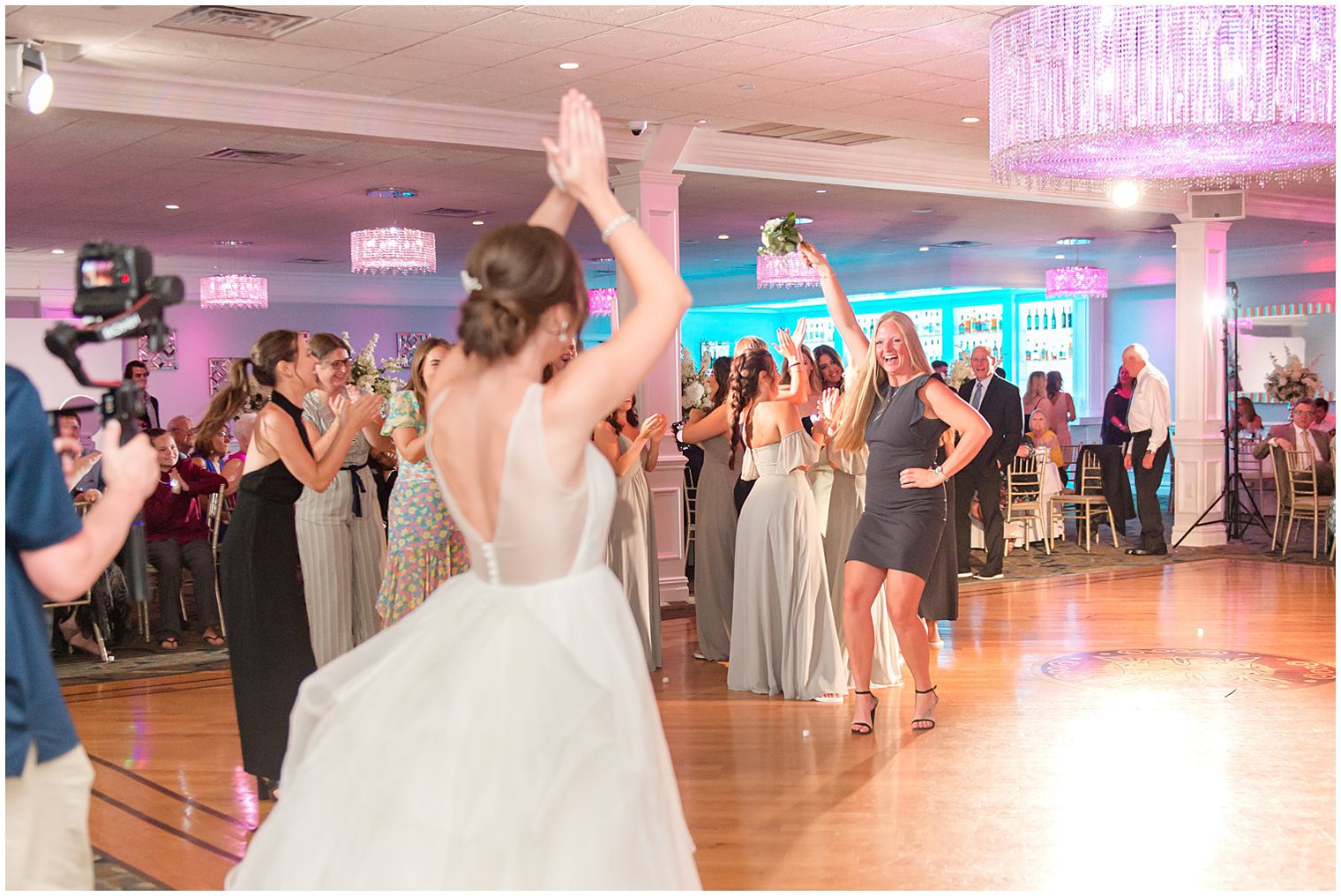 wedding guest tosses bouquet during NJ wedding reception