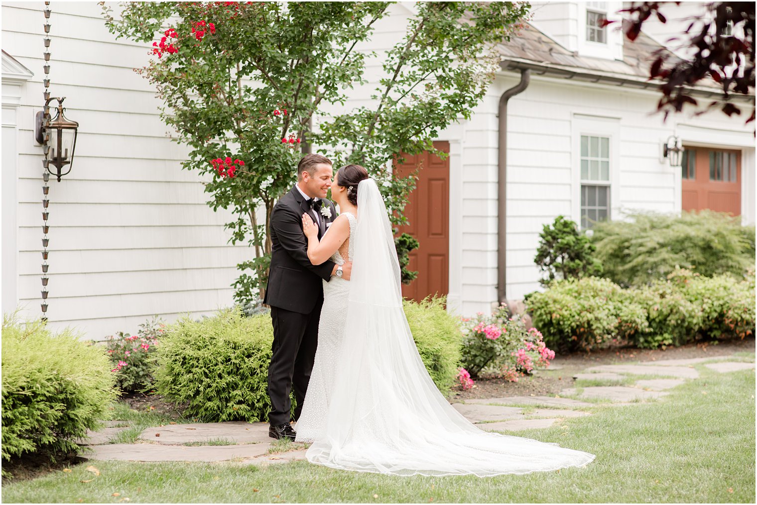 bride and groom stand nose to nose in New Jersey 