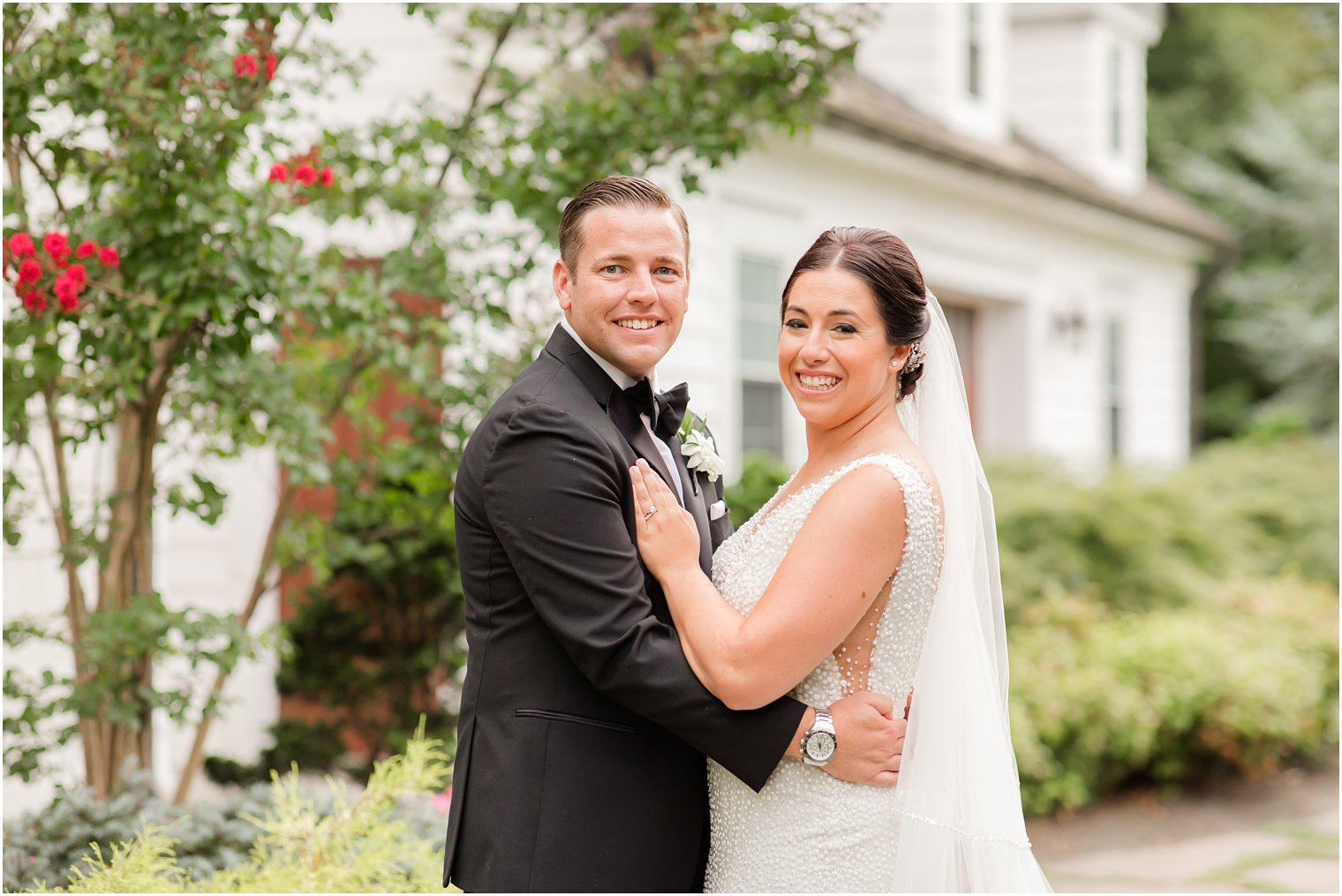 newlyweds pose on lawn in Ocean Township NJ
