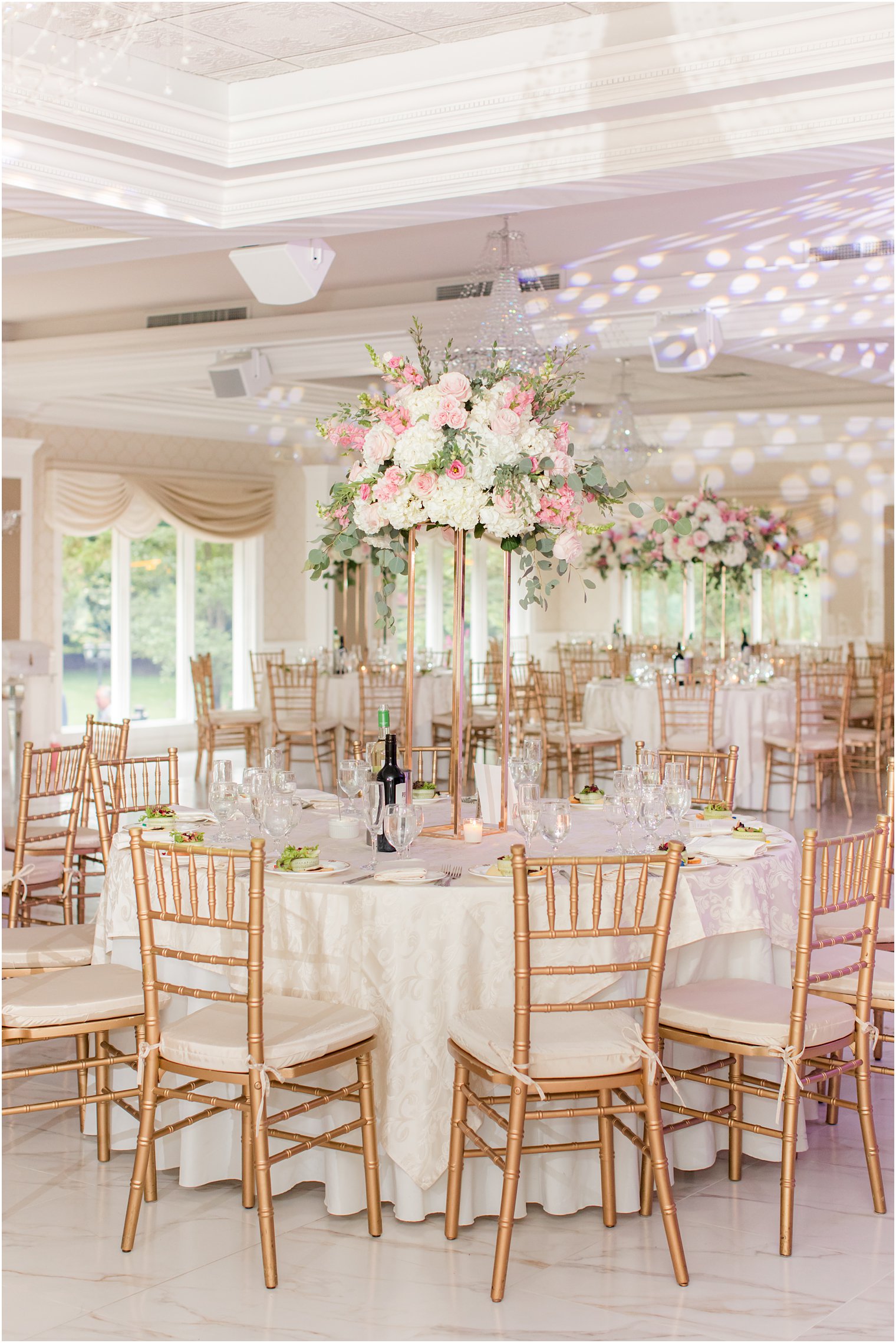 wedding reception at The English Manor with tall floral centerpieces 