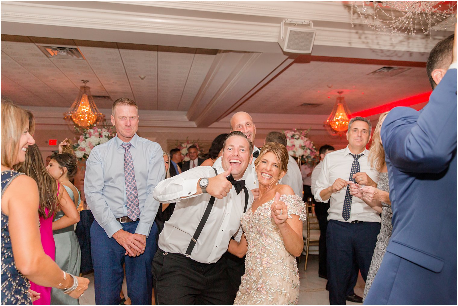 groom and mom smile on dance floor during NJ wedding day