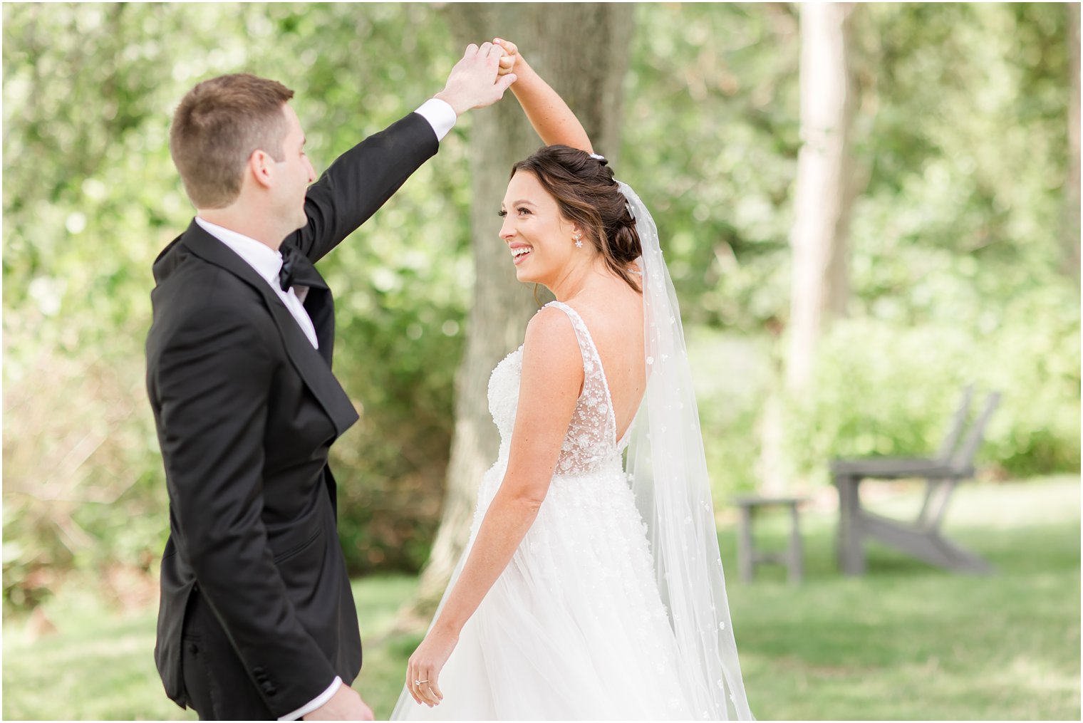 groom twirls bride during first look in Franklin Lakes NJ
