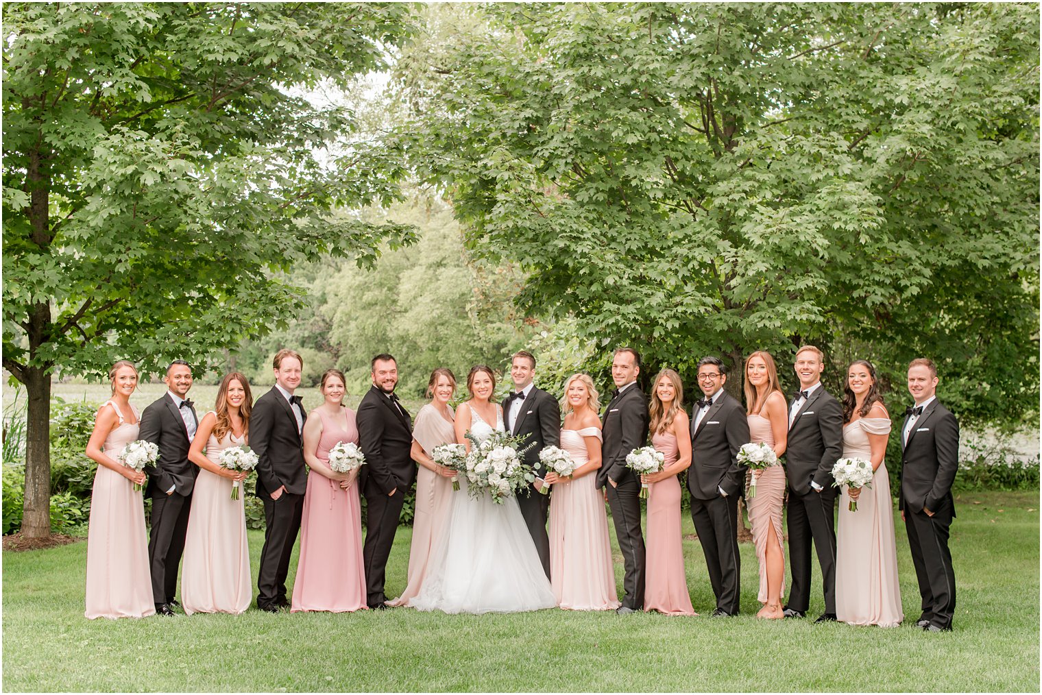 bride and groom pose with bridal party at Indian Trail Club