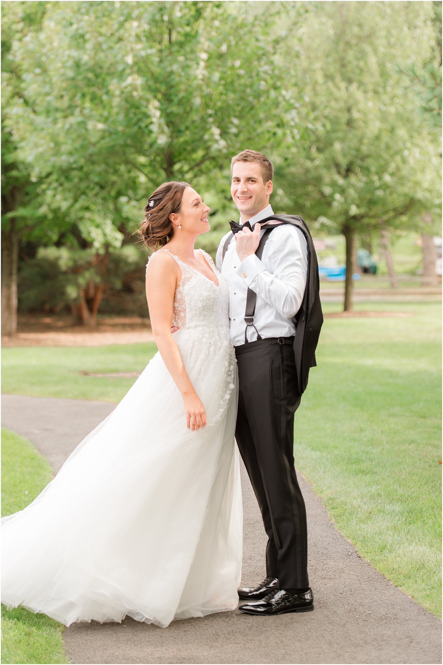 bride looks up at groom during Franklin Lakes NJ wedding photos