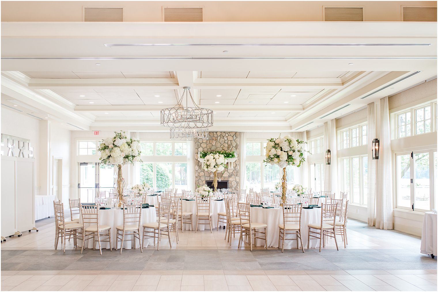 Indian Trail Club wedding reception in ballroom with stone fireplace