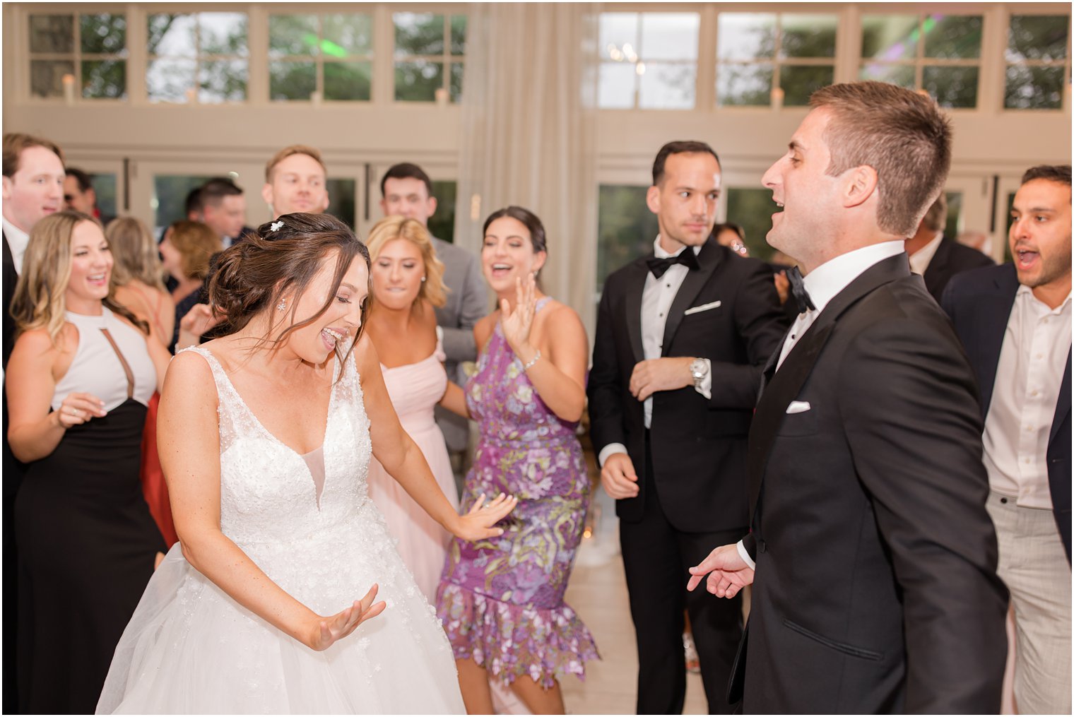 newlyweds dance with guests at Franklin Lakes NJ wedding reception