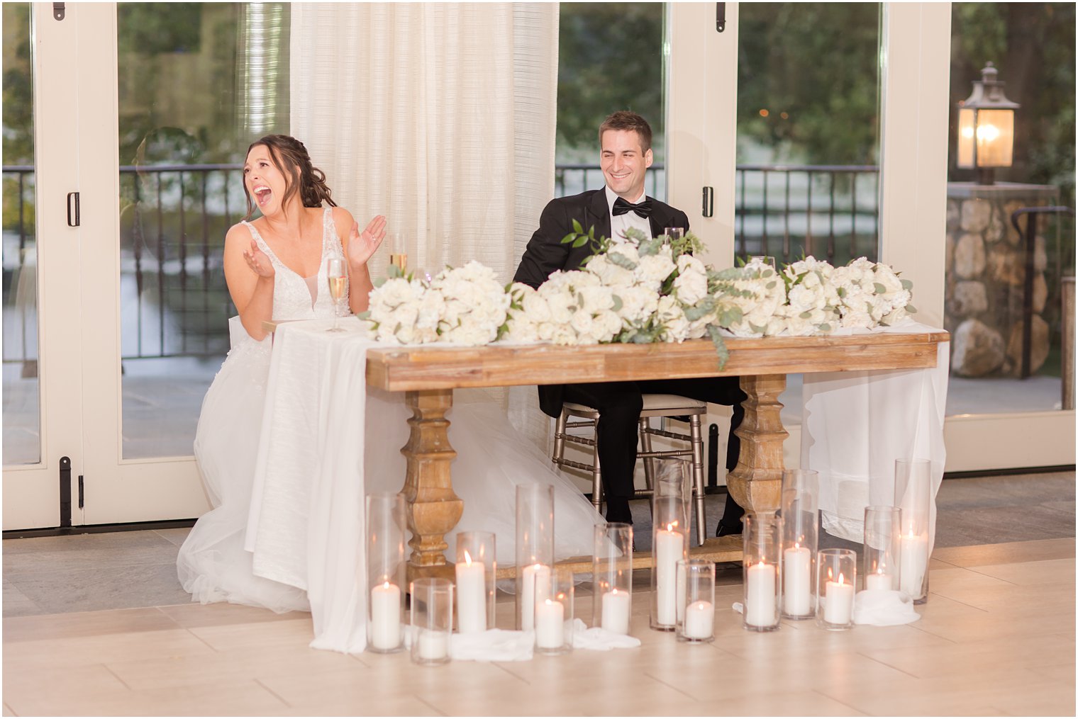 bride laughs during wedding reception 