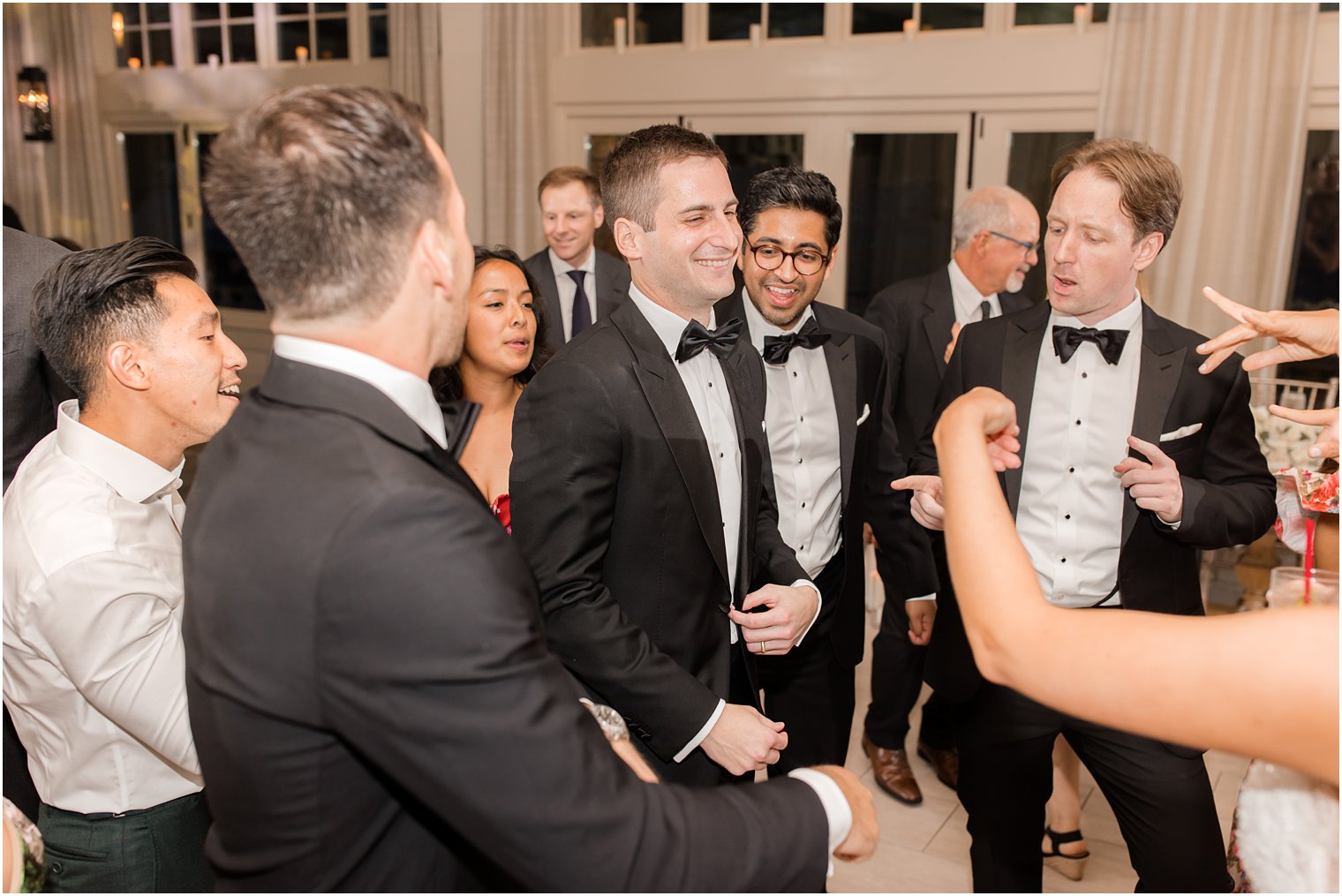 groom dances with groomsmen at Franklin Lakes reception 