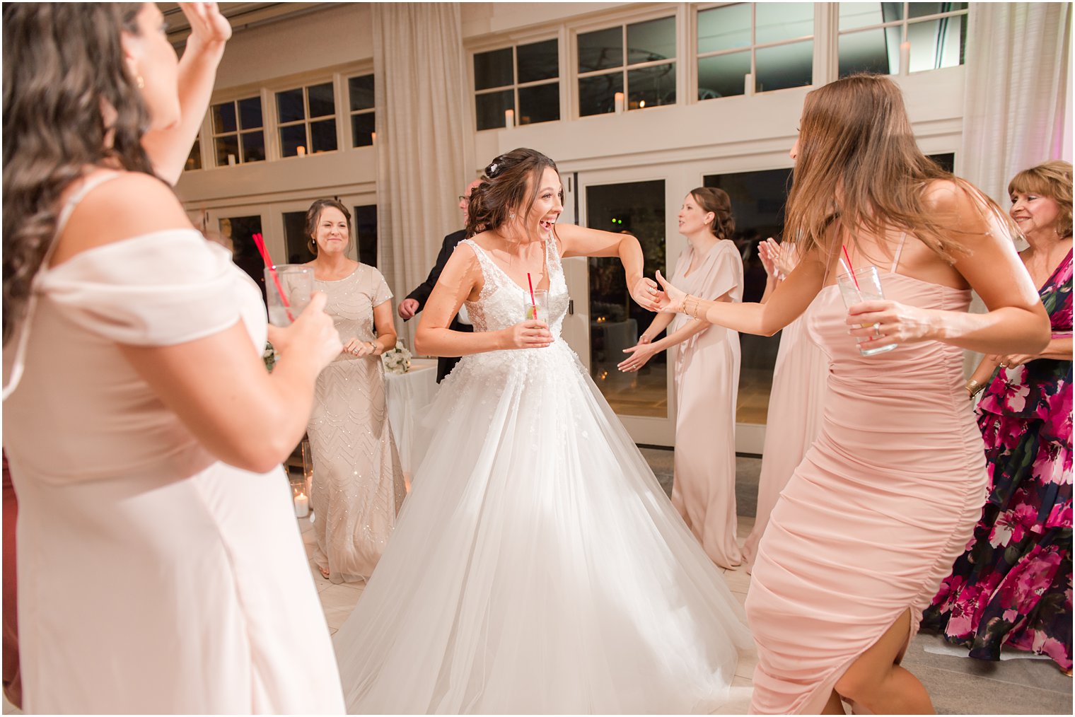 bride dances with bridesmaids at Franklin Lakes NJ reception 