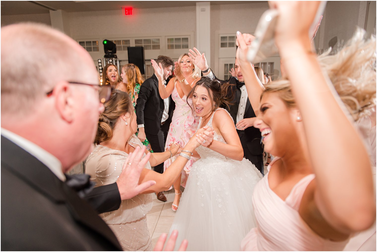 bride dances with family at Franklin Lakes NJ wedding reception