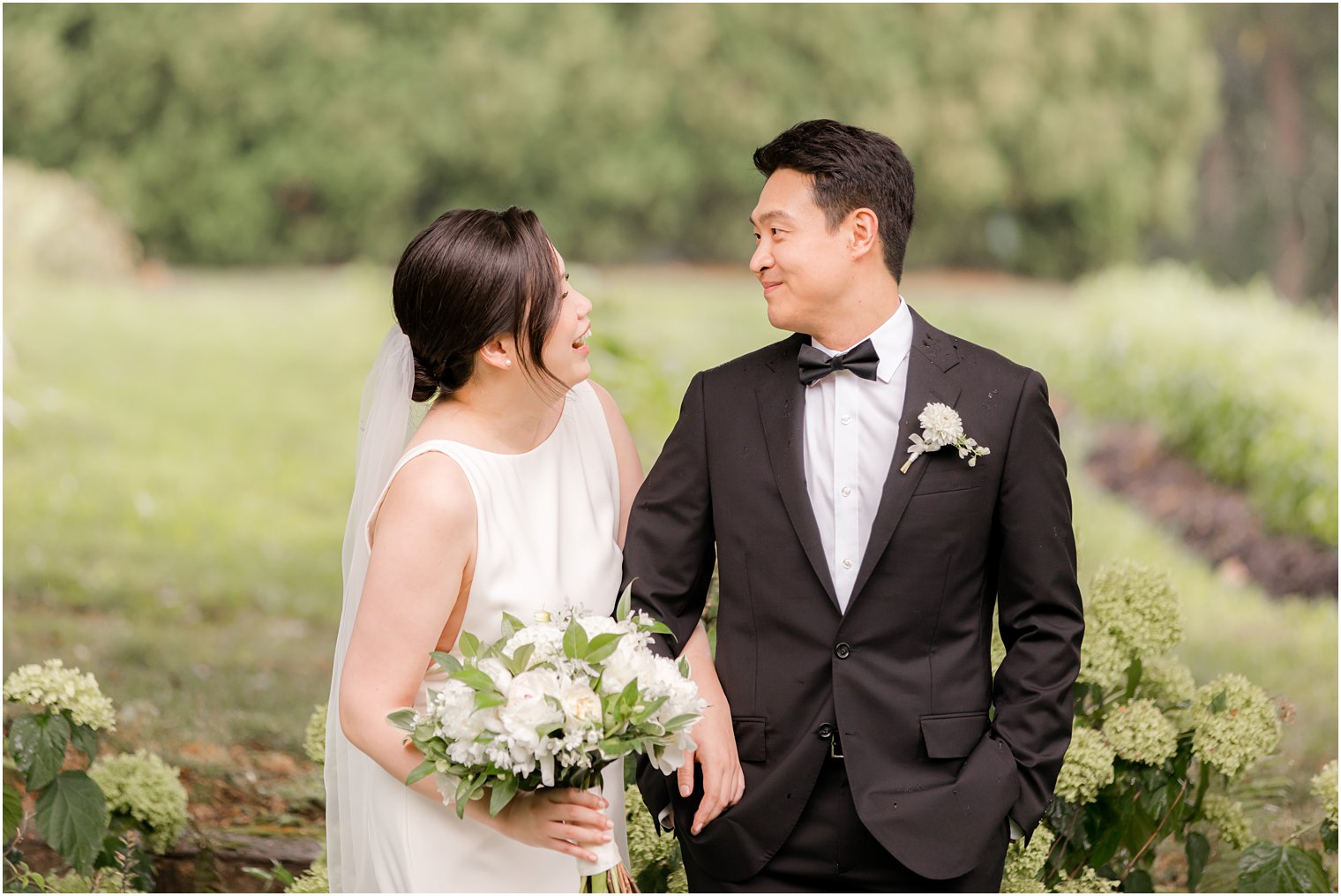 bride and groom laugh during portraits on NJ wedding day