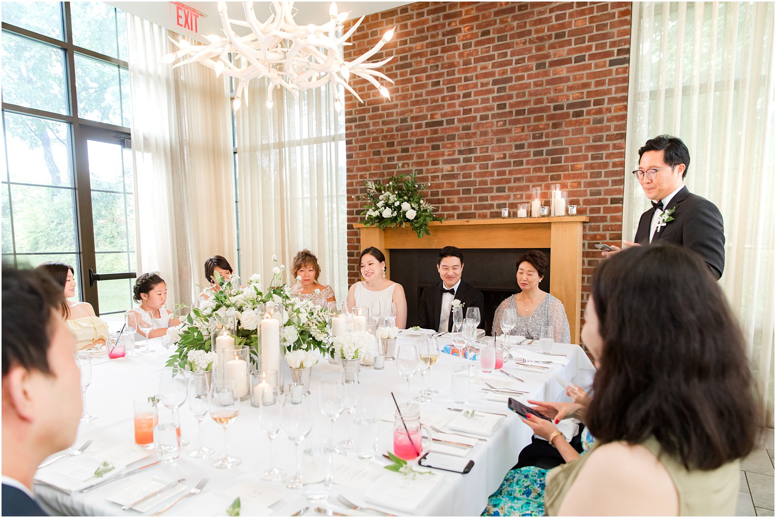 father reads speech during reception at Ninety Acres