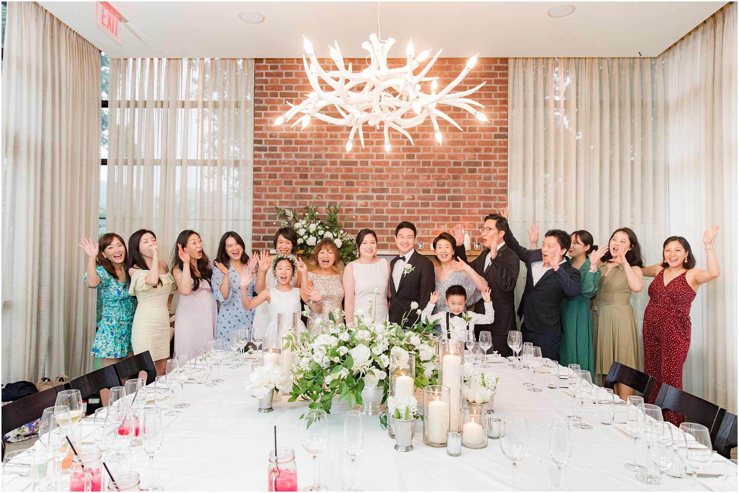 guests and bride and groom cheer during microwedding at Ninety Acres