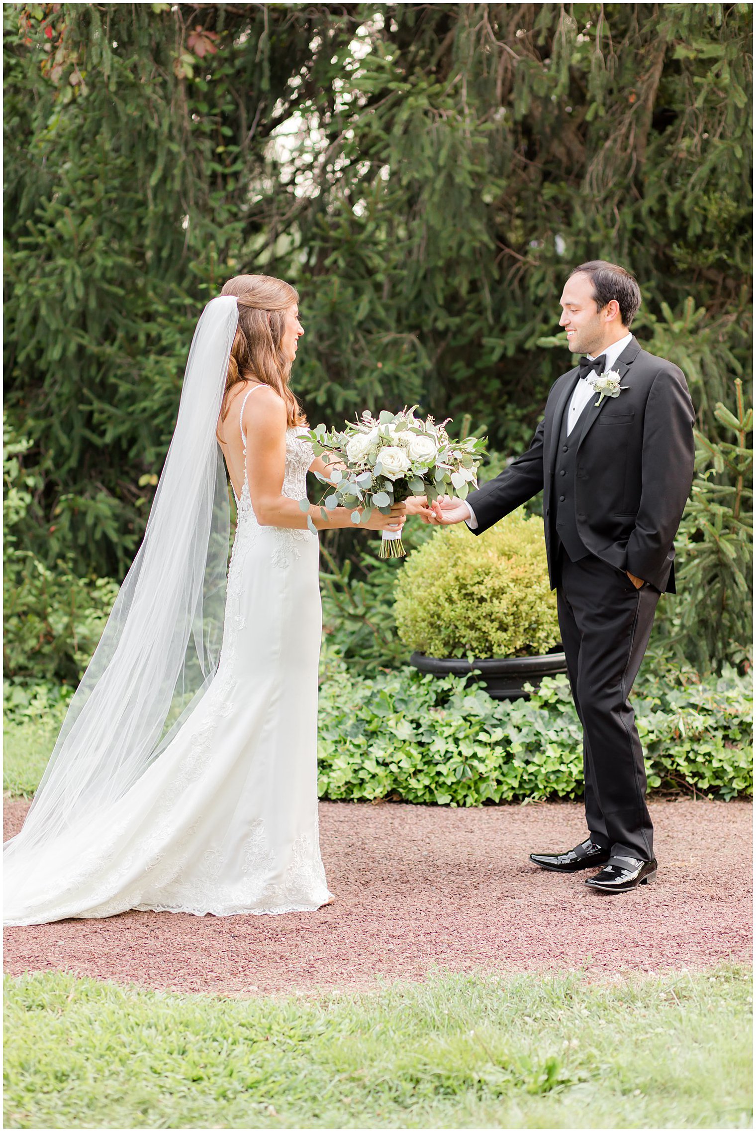 bride and groom laugh during first look