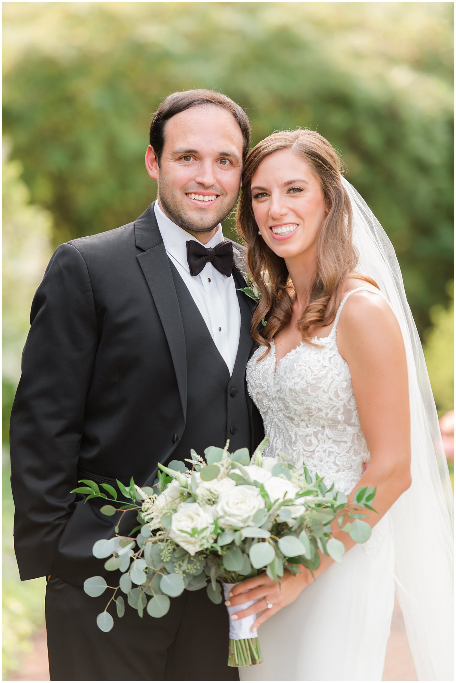bride and groom pose together at the Inn at Fernbrook Farms