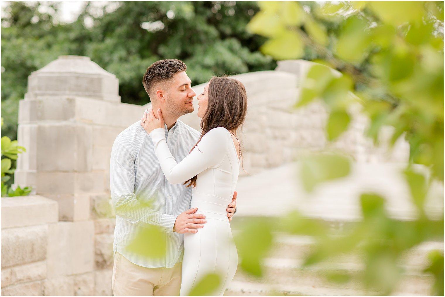 bride and groom nuzzle noses during NJ engagement photos