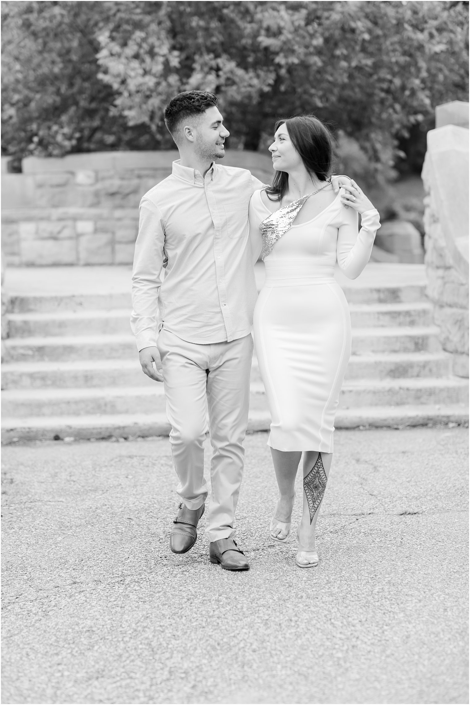 bride and groom hold hands walking through Verona Park