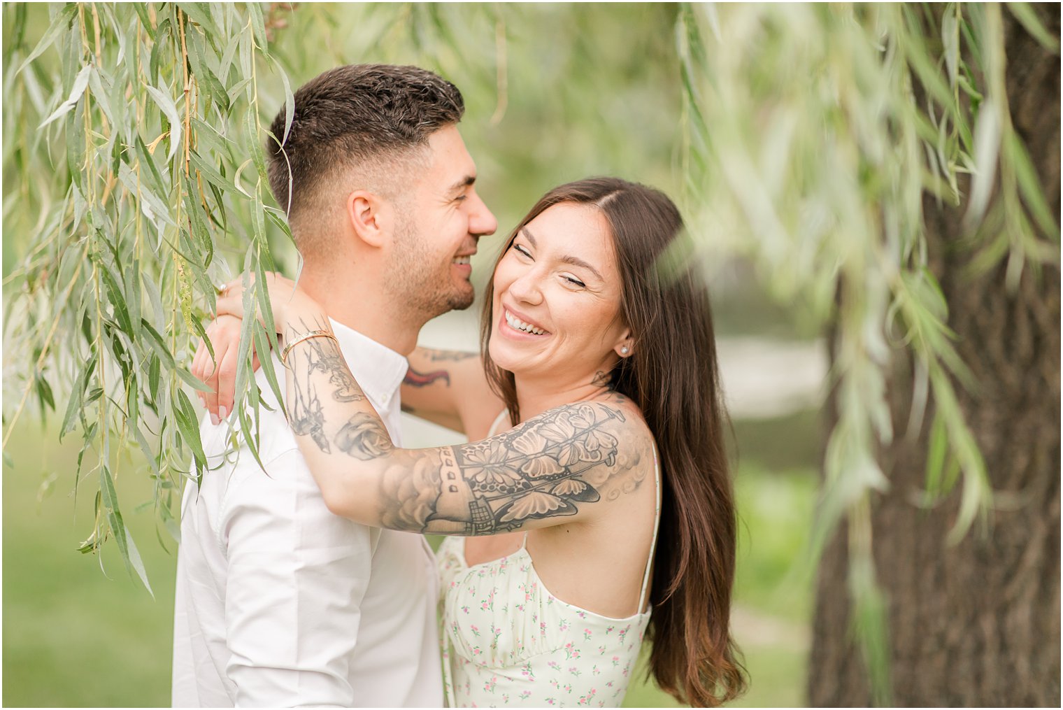 groom laughs with bride during NJ engagement session