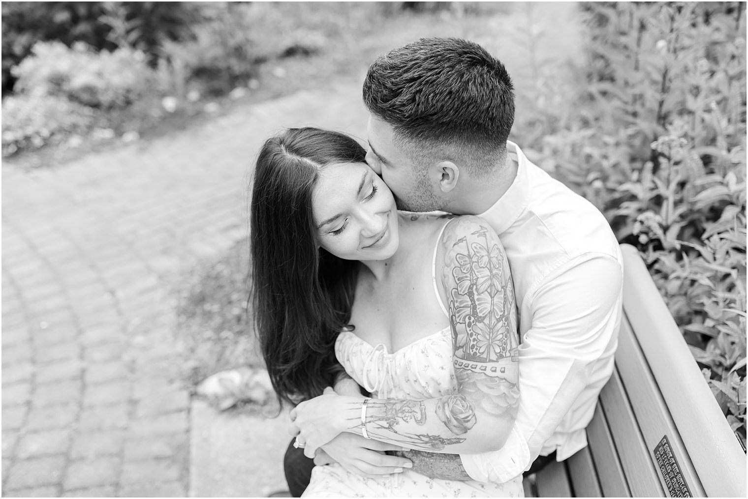 groom hugs bride during Verona Park engagement session