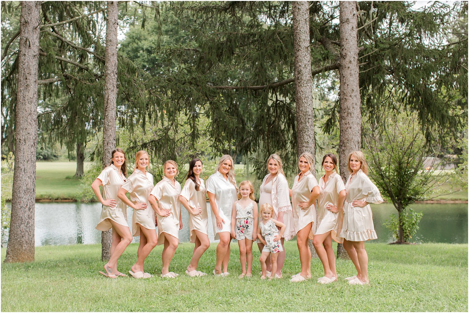 bride and bridesmaids pose in matching pjs at Windows on the Water at Frogbridge