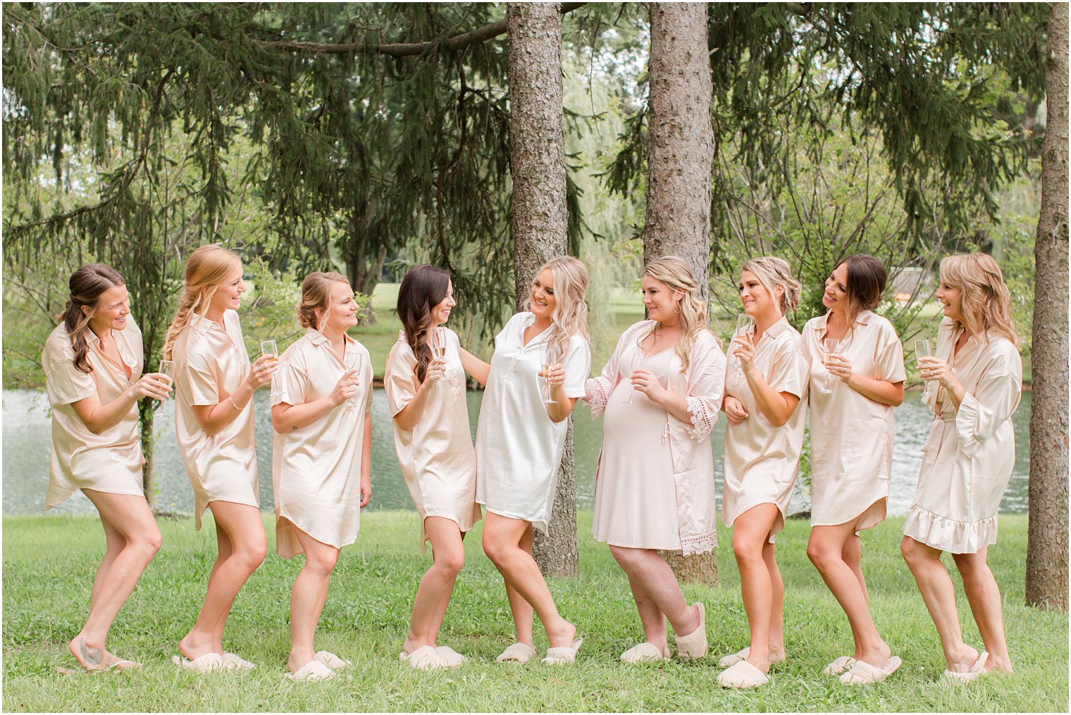 bride poses with bridesmaids at Windows on the Water at Frogbridge