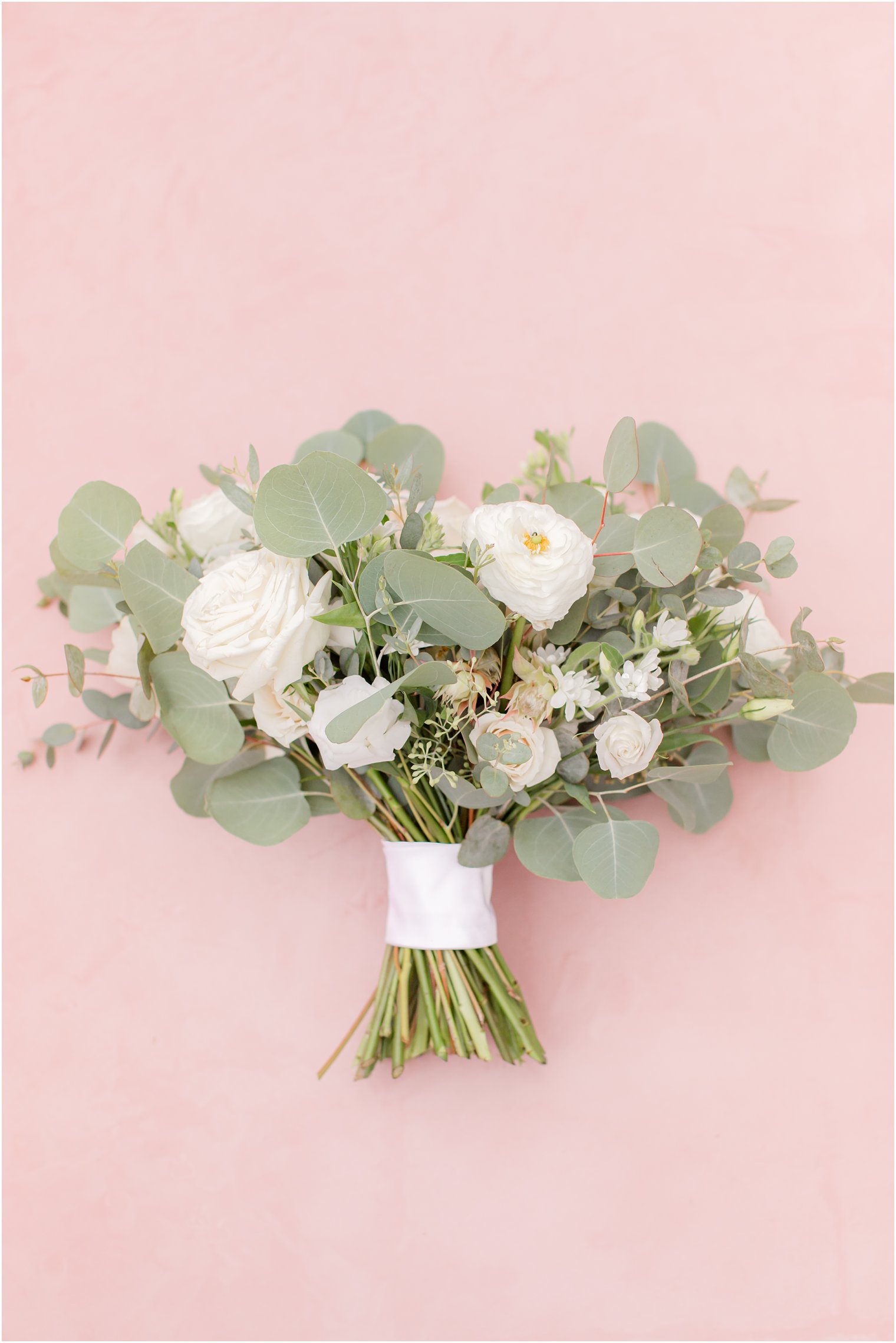 bride's bouquet with pink and ivory flowers