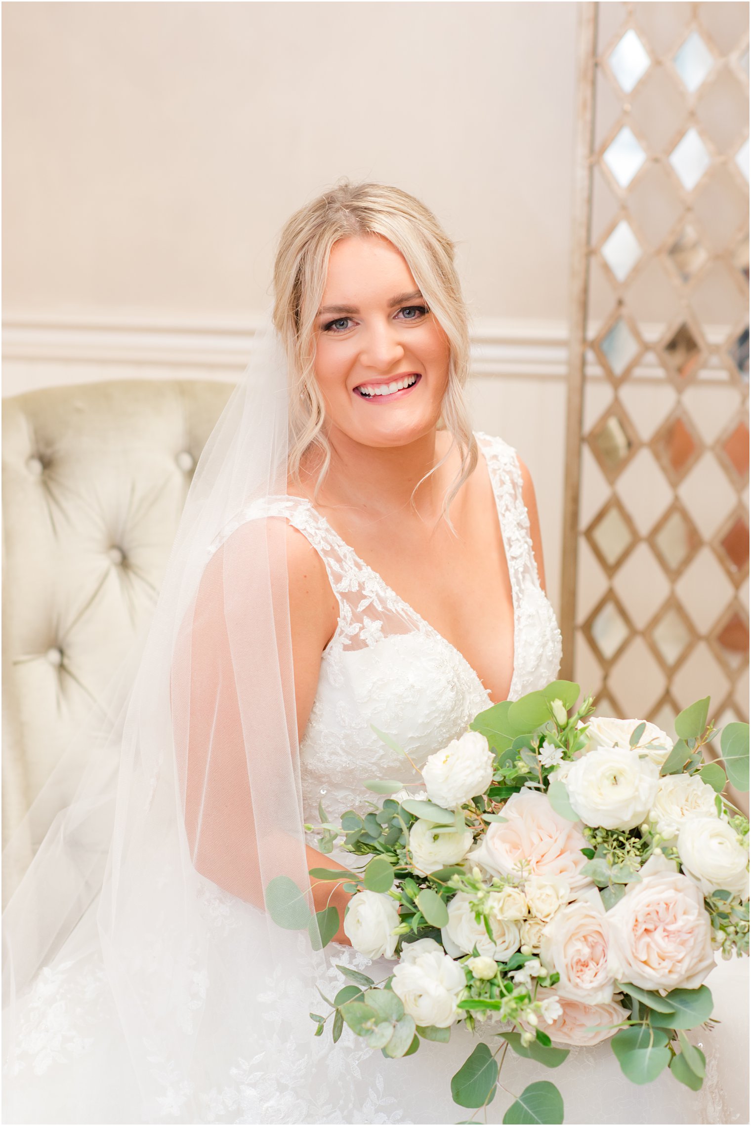 bride sits in bridal suite at Windows on the Water at Frogbridge