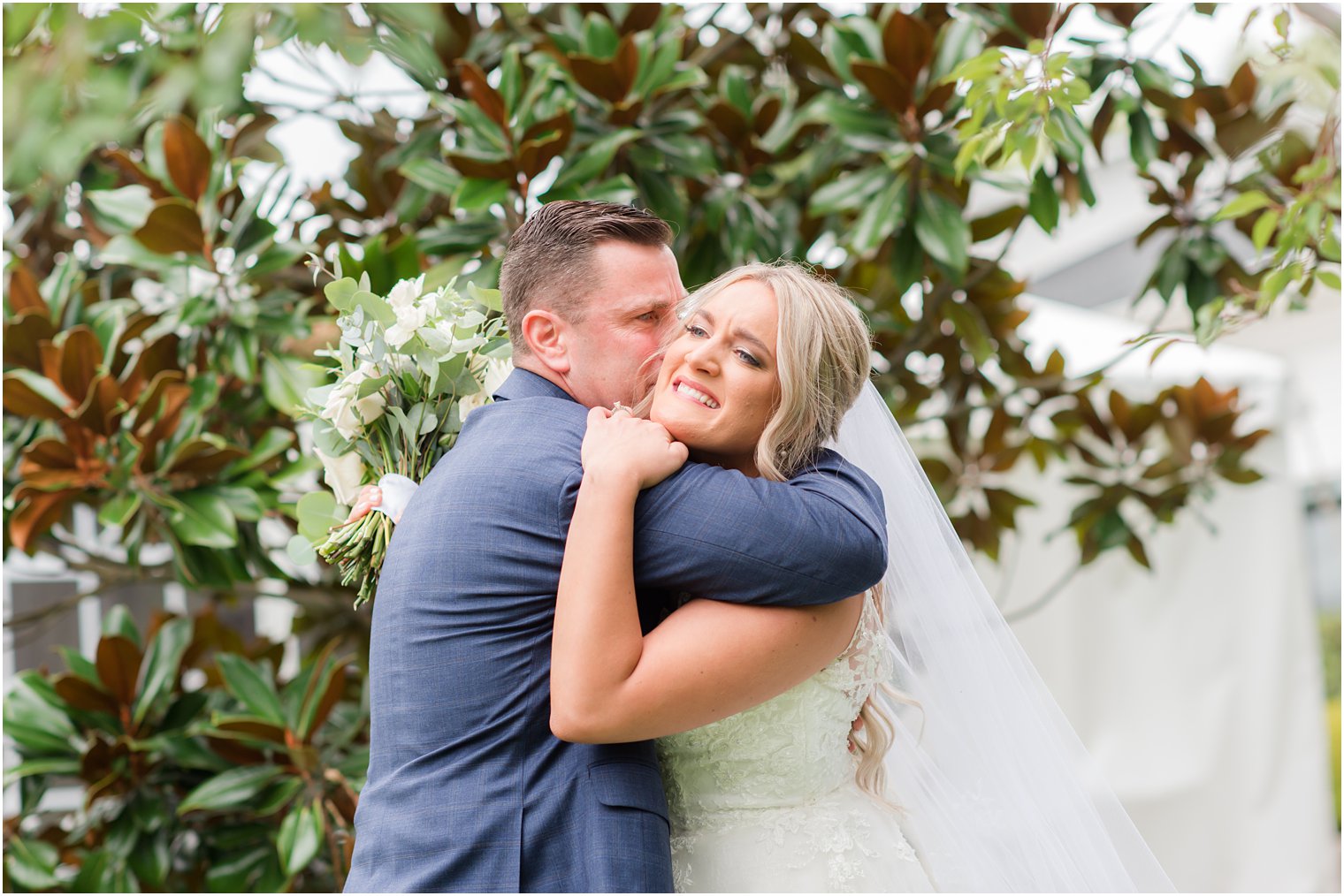 bride hugs dad on wedding day at Windows on the Water at Frogbridge