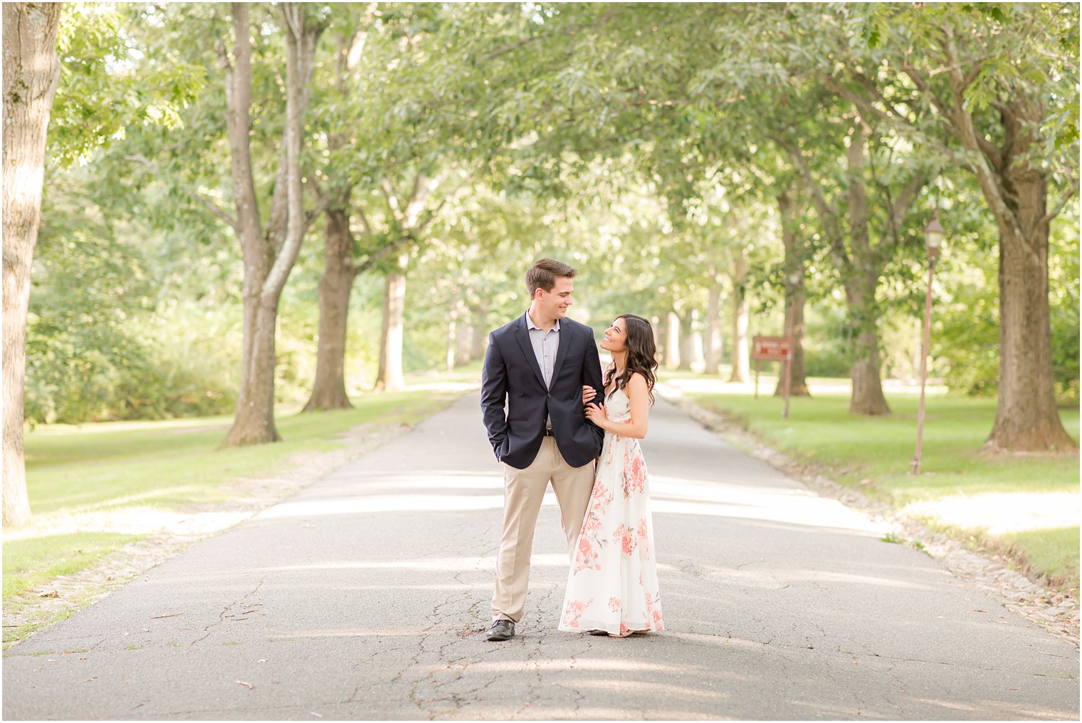 bride looks up at groom during NJ engagement session