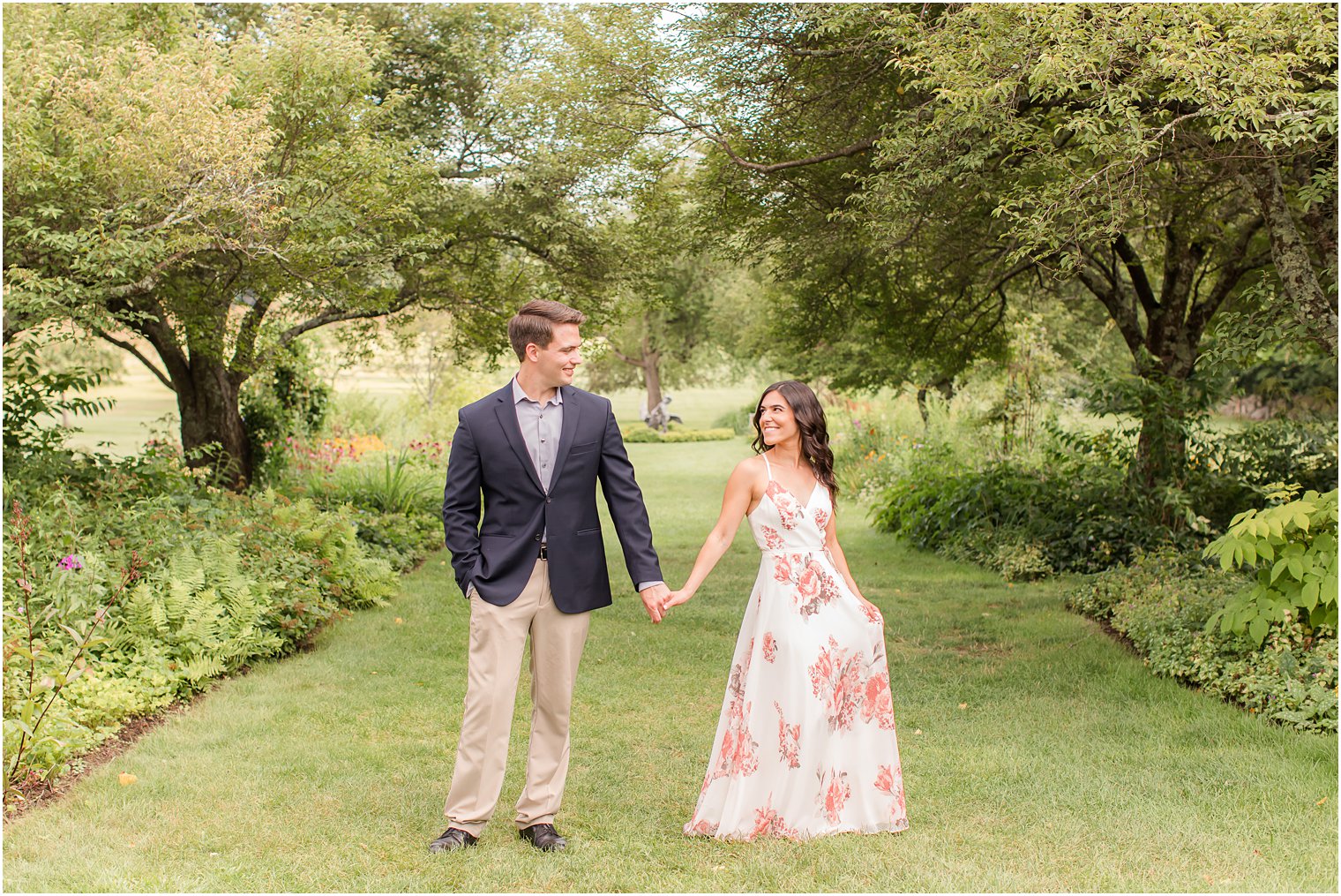 bride and groom hold hands during Skylands Manor engagement session