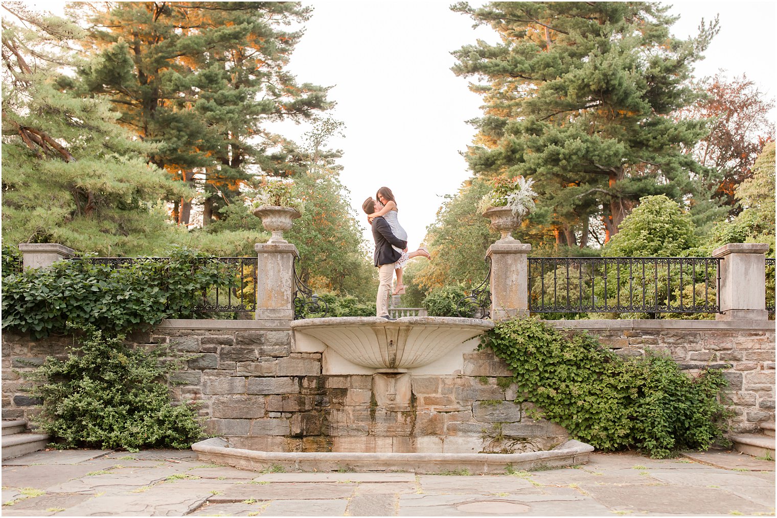 groom lifts bride up during Skylands Manor engagement session