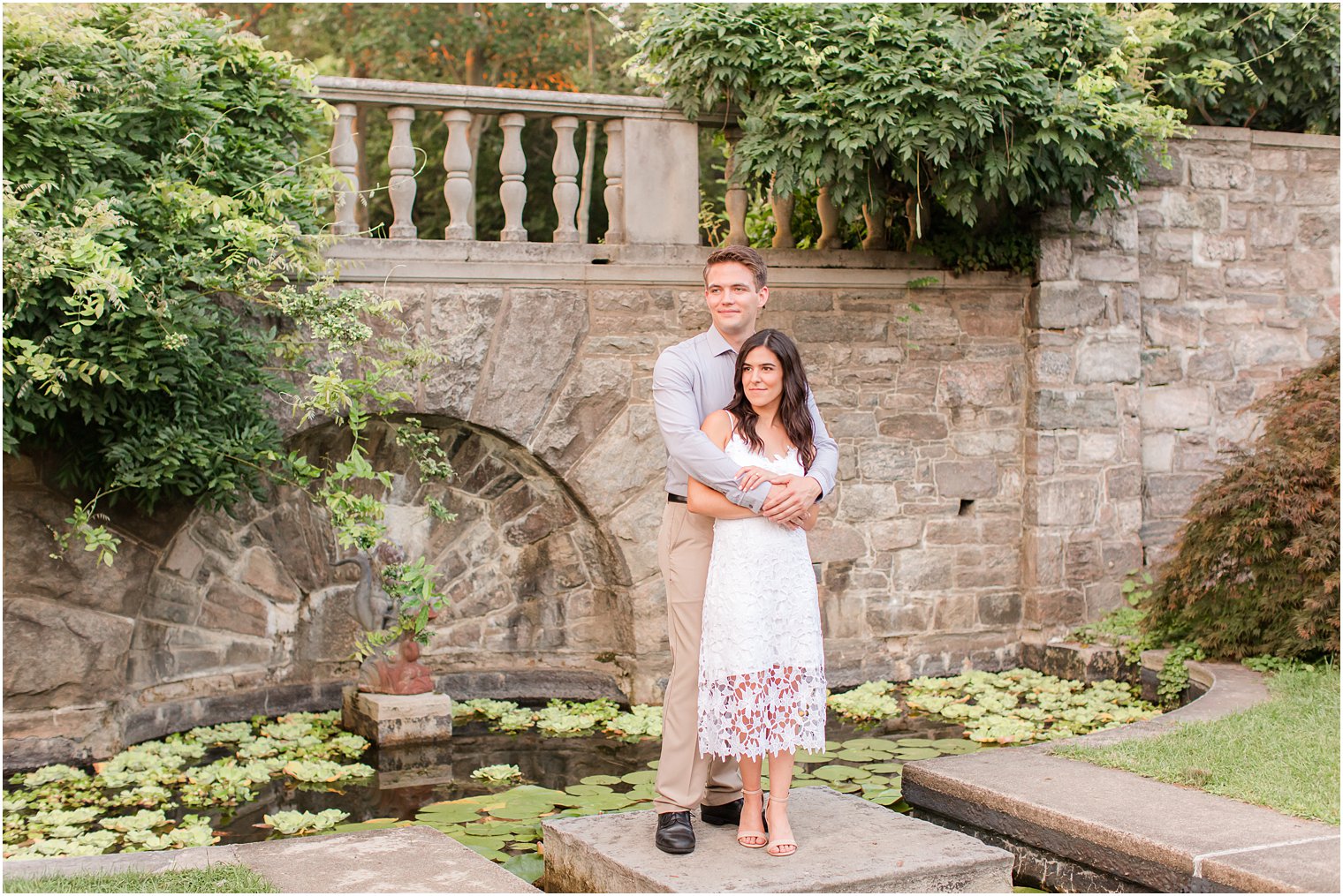 groom hugs bride during Skylands Manor engagement session