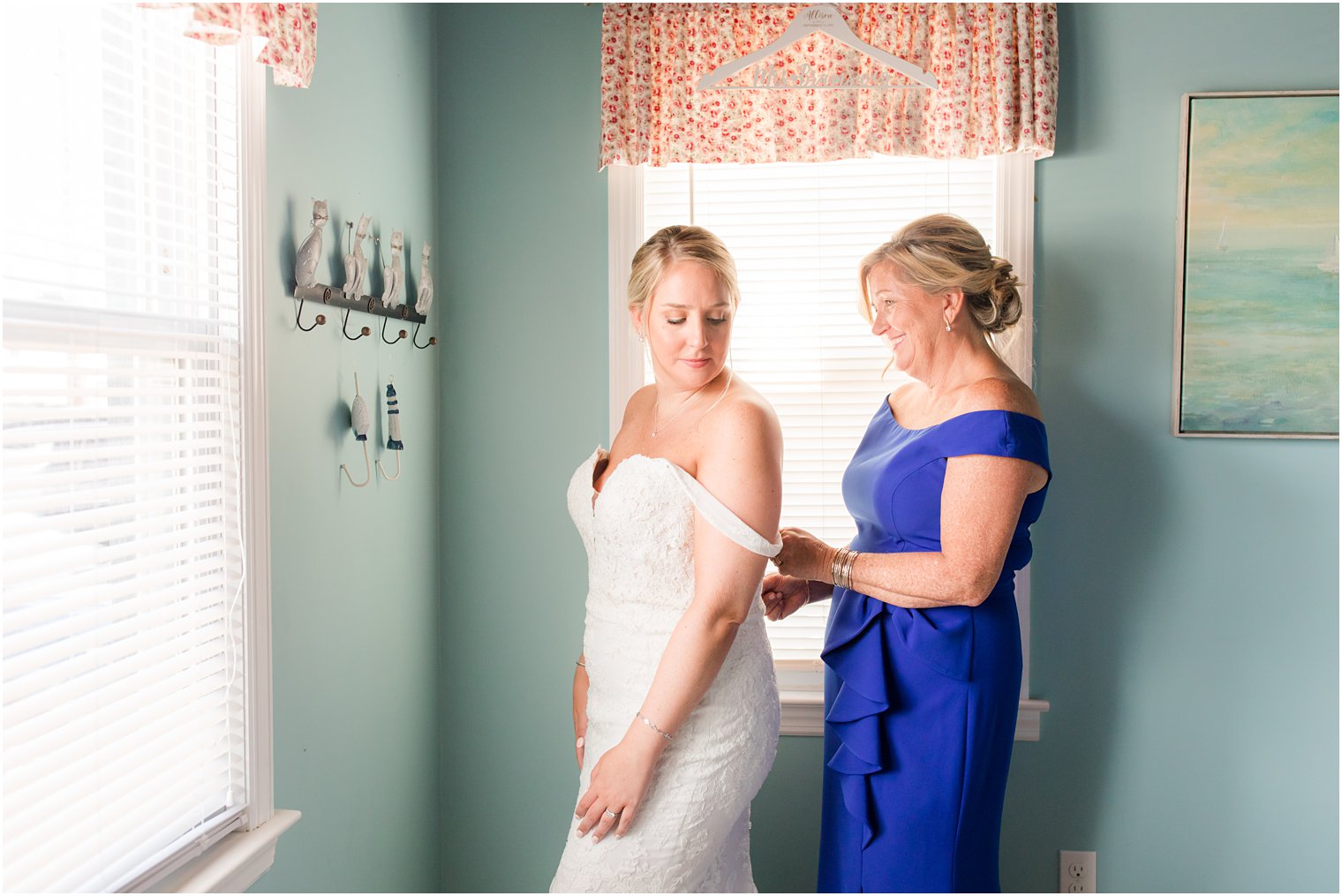 mother helps bride with wedding gown for LBI celebration 