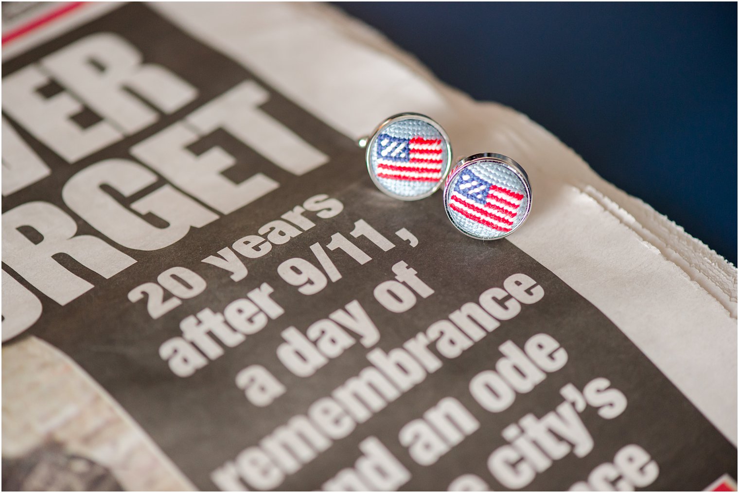 custom American flag cufflinks rest on anniversary 9/11 article in newspaper