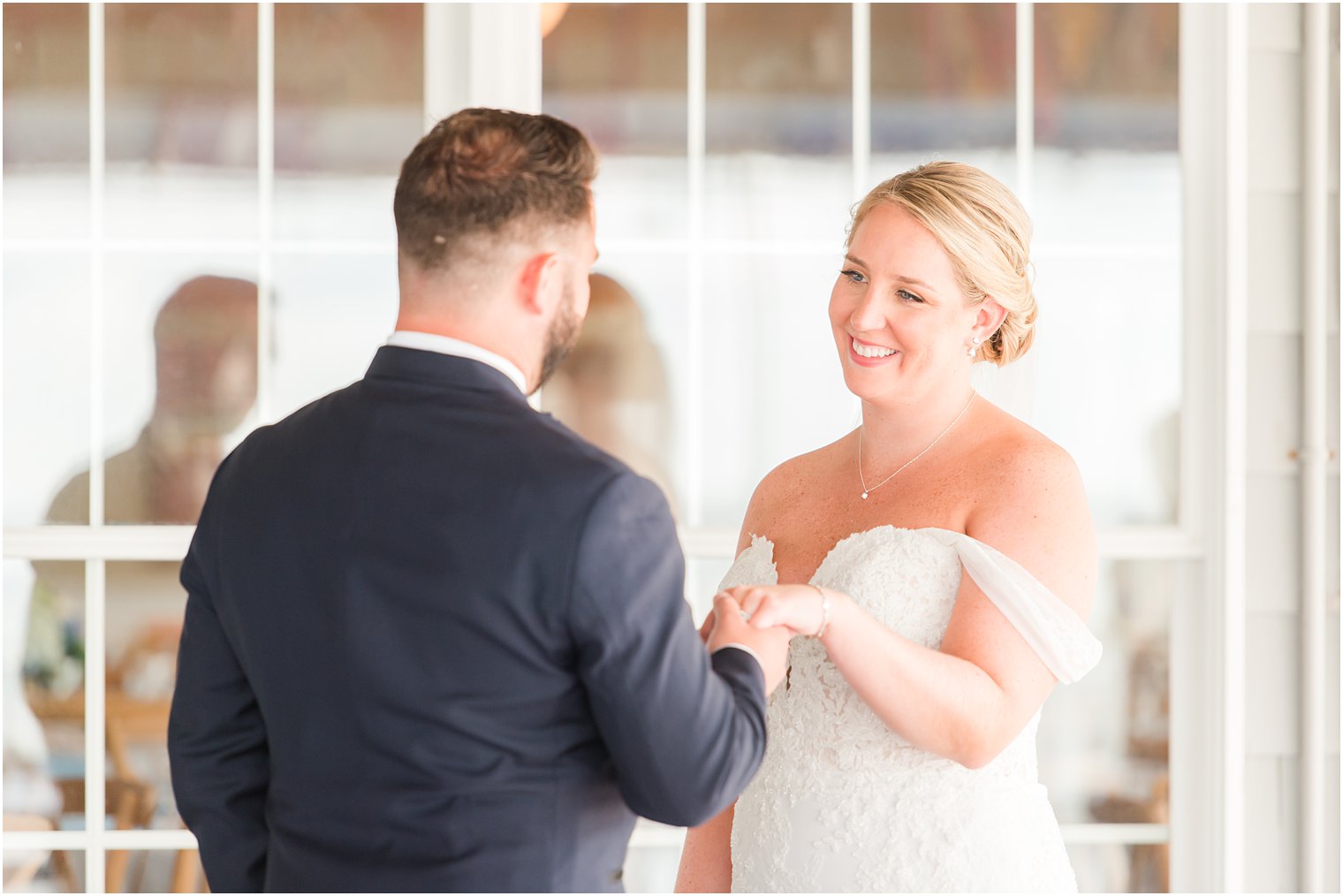 groom has first look with bride on wedding day in New Jersey