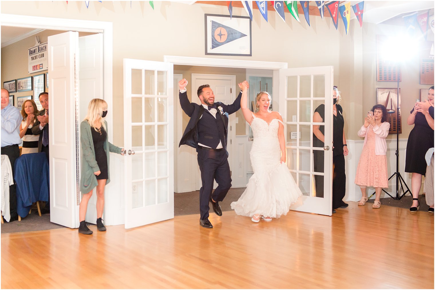 bride and groom enter wedding reception at Brant Beach Yacht Club