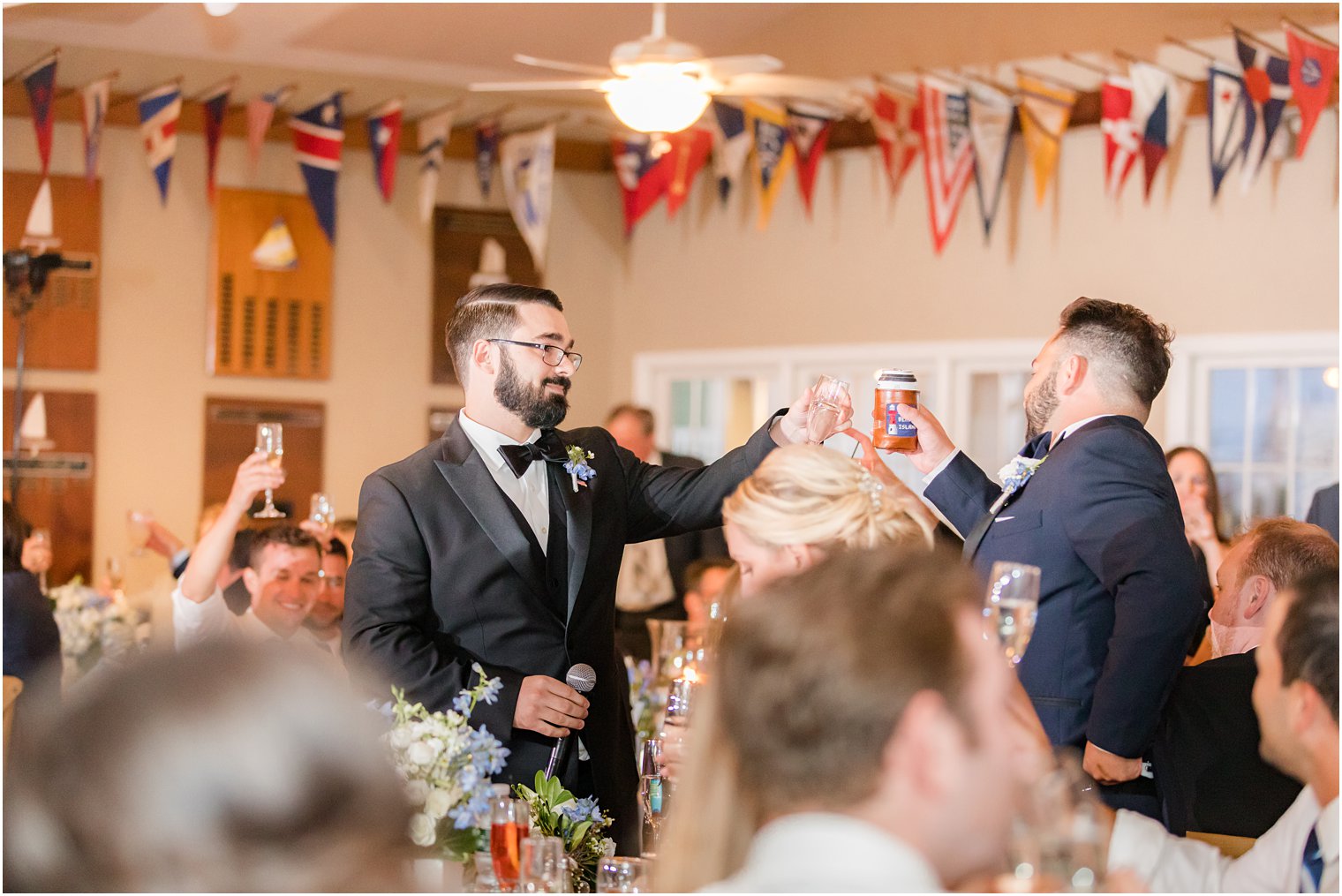 groom toasts with best man after speech at Brant Beach Yacht Club