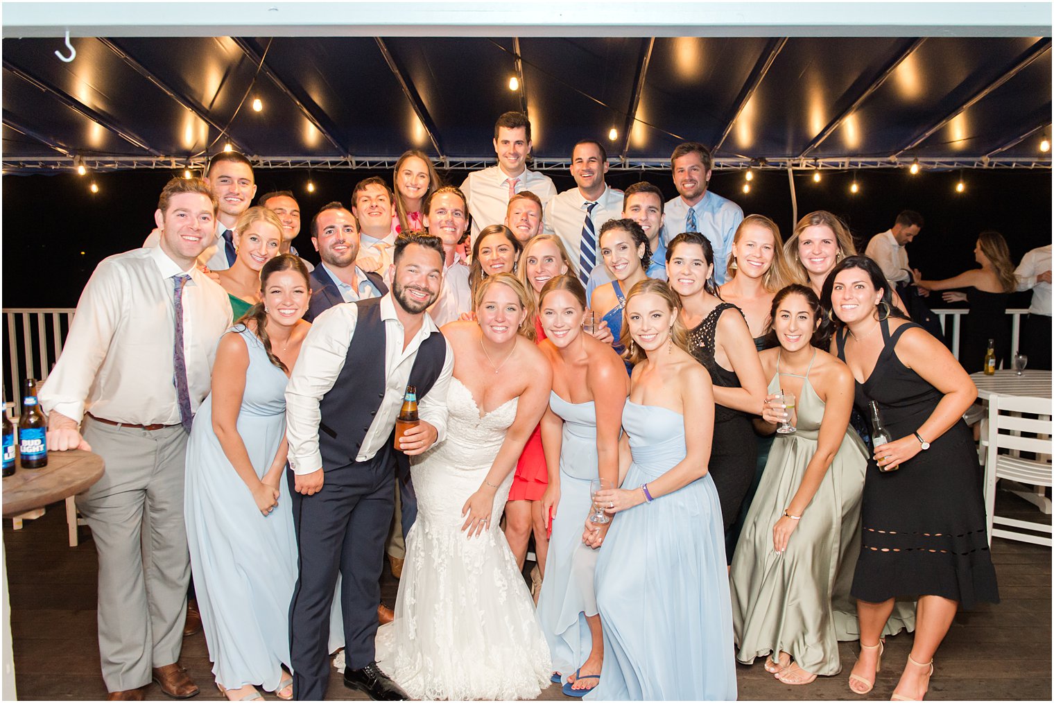 bride and groom pose with guests at Brant Beach Yacht Club