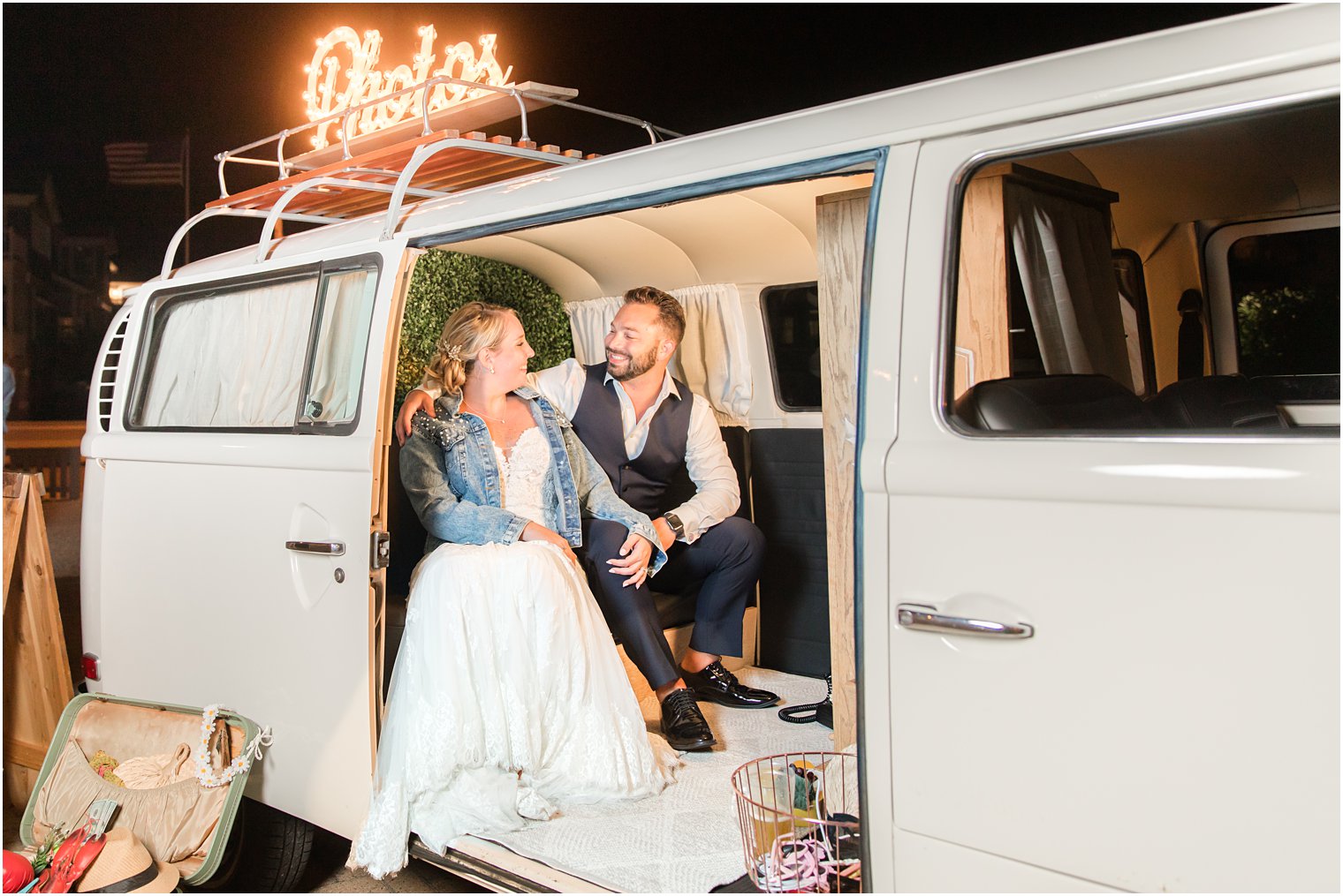 bride and groom pose in vintage bus photo booth at Brant Beach Yacht Club