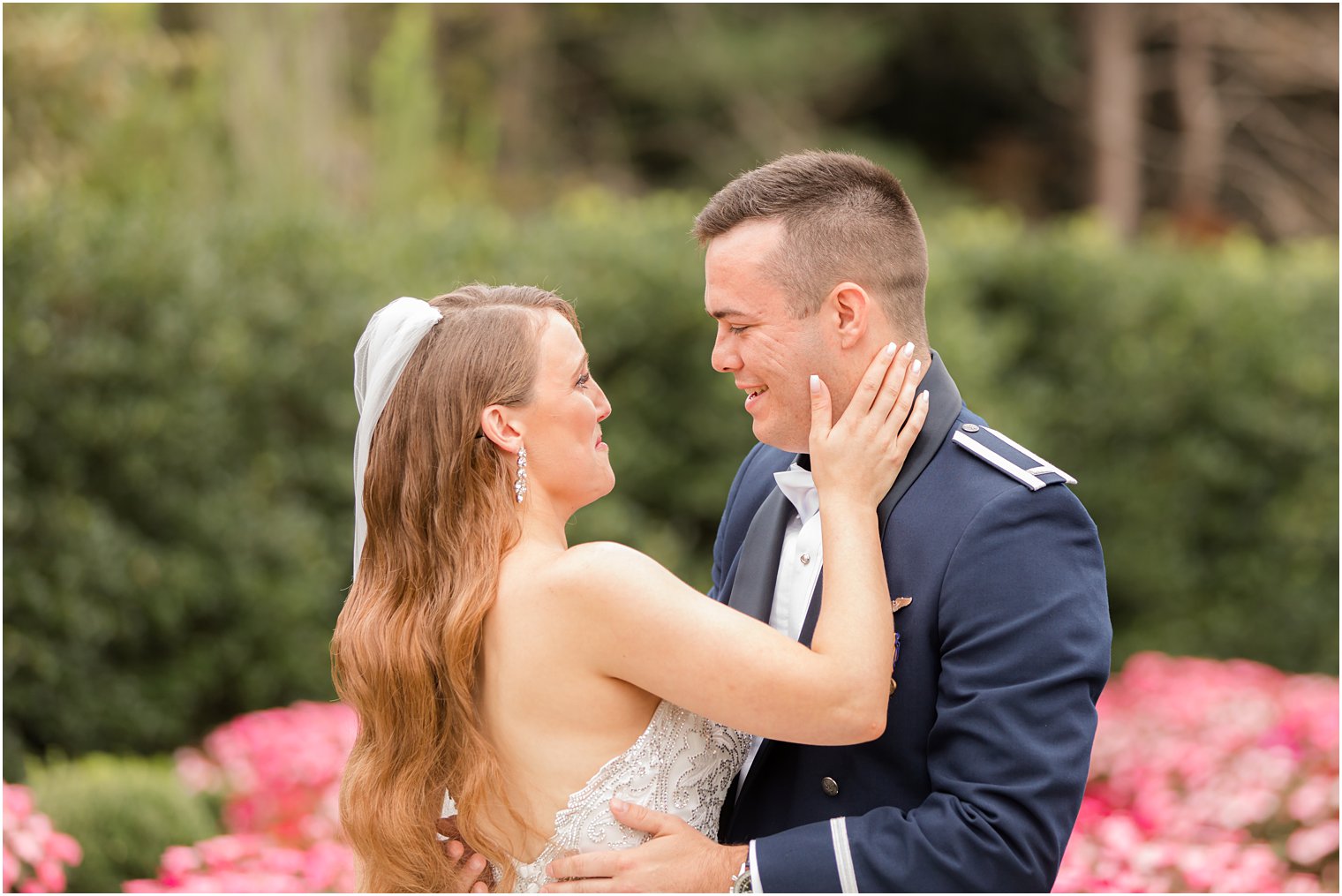 bride holds groom's cheek during NJ wedding day first look