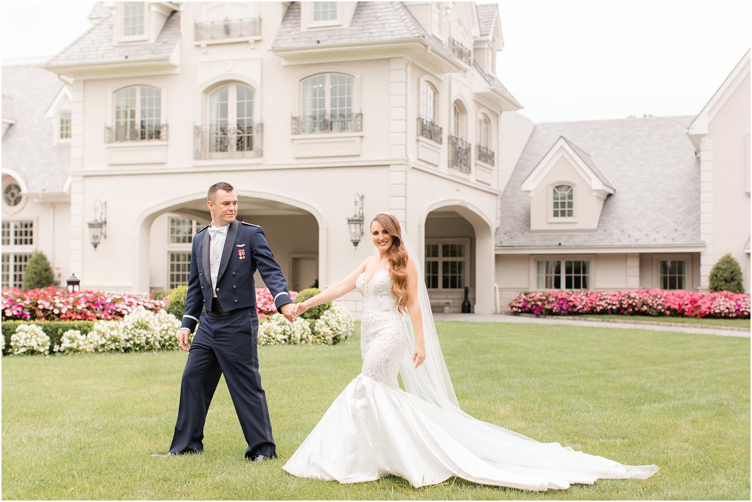bride and groom walk on lawn at Park Chateau Estate