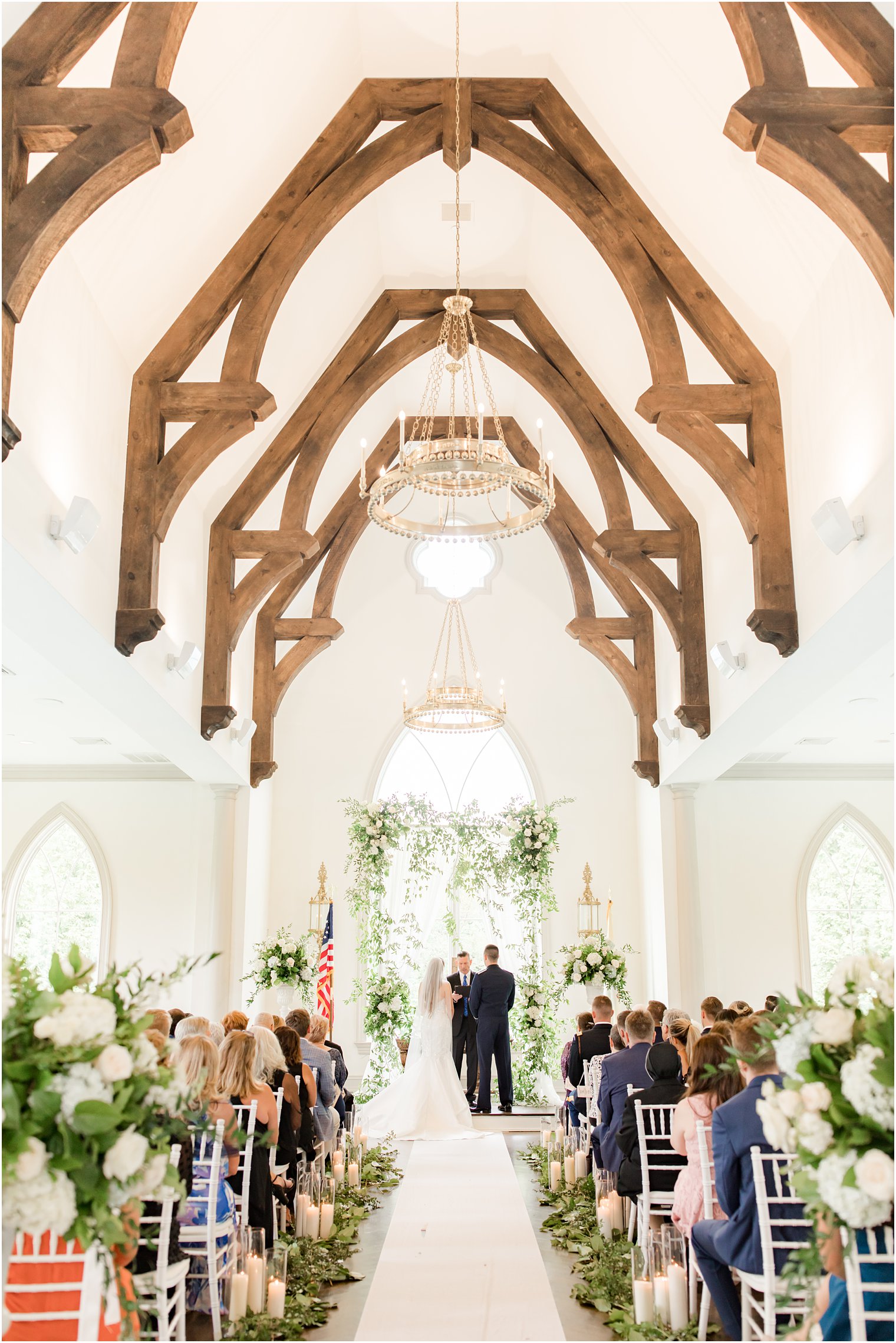 bride and groom stand at alter during East Brunswick NJ wedding ceremony in chapel