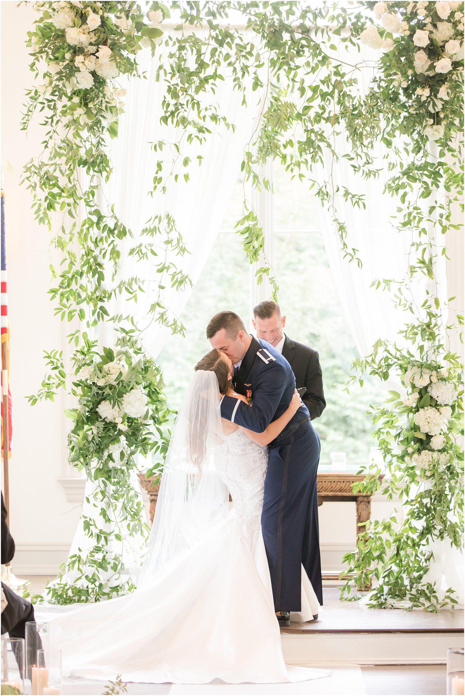 newlyweds kiss during East Brunswick NJ wedding ceremony in chapel
