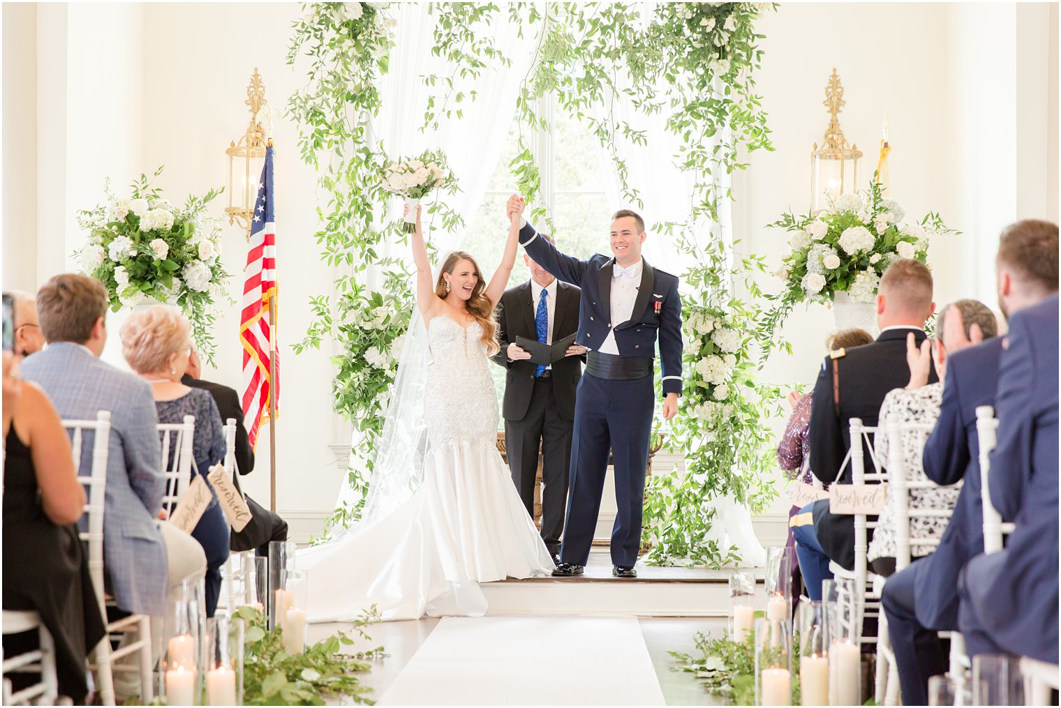 newlyweds cheer after East Brunswick NJ wedding ceremony in chapel