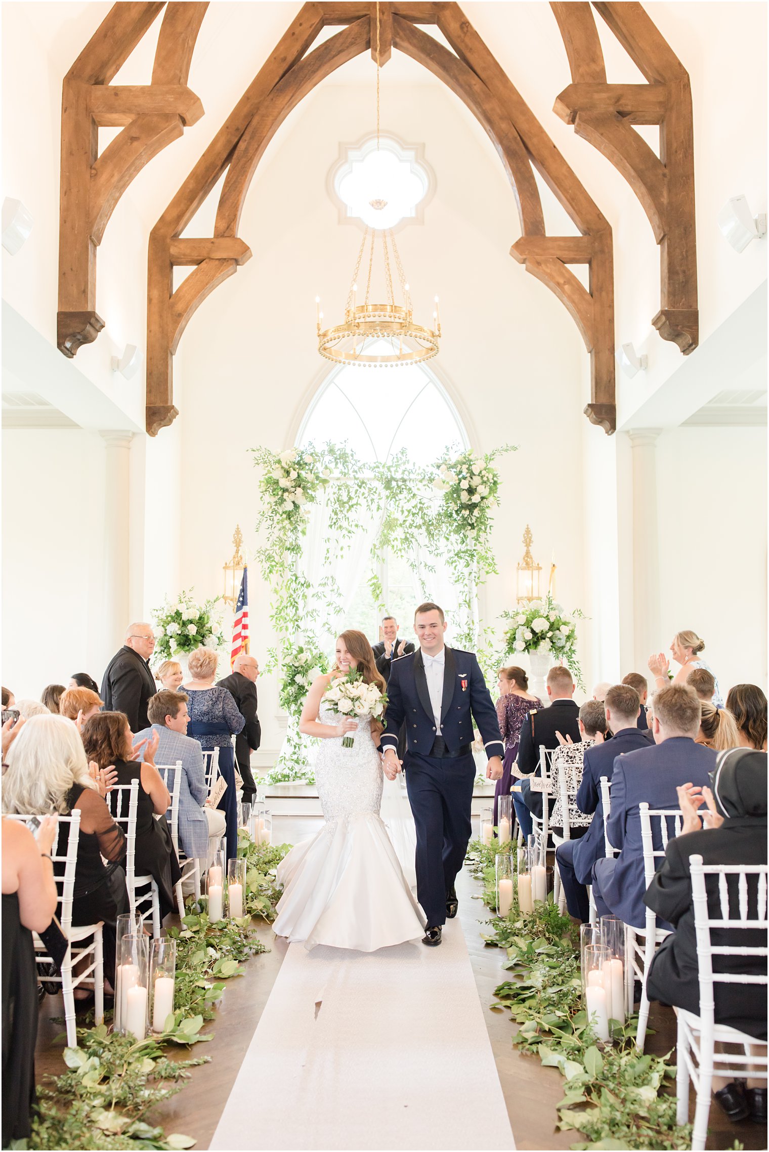bride and groom walk down aisle in chapel at Park Chateau Estate