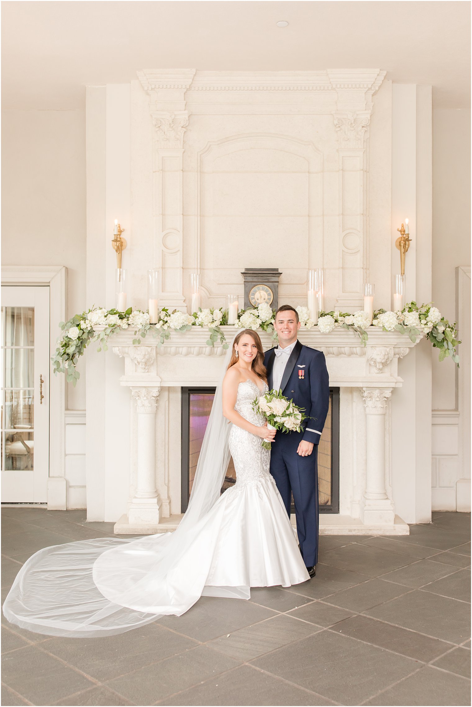 bride and groom pose by fireplace at Park Chateau Estate