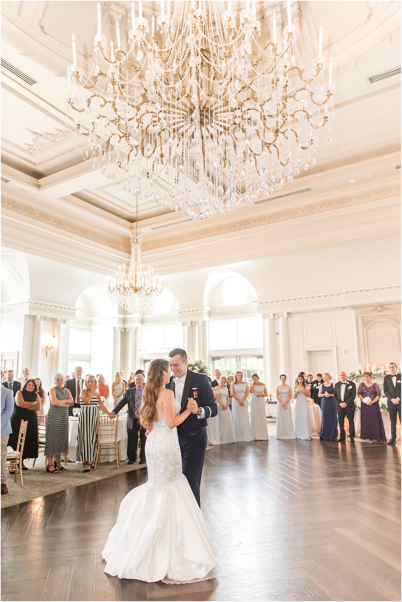 newlyweds have first dance under chandelier at East Brunswick NJ wedding reception