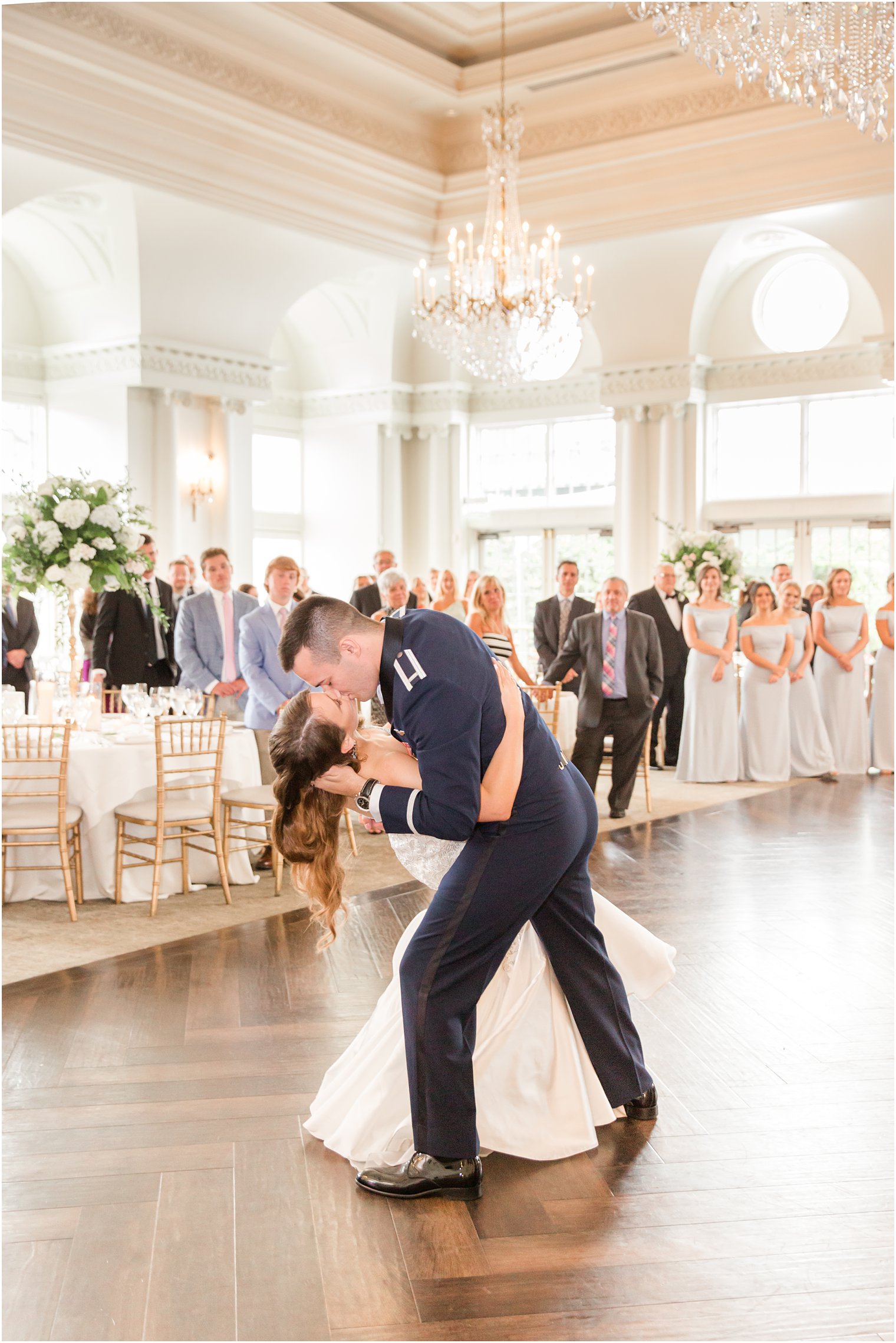 groom kisses bride while dipping her at East Brunswick NJ wedding reception